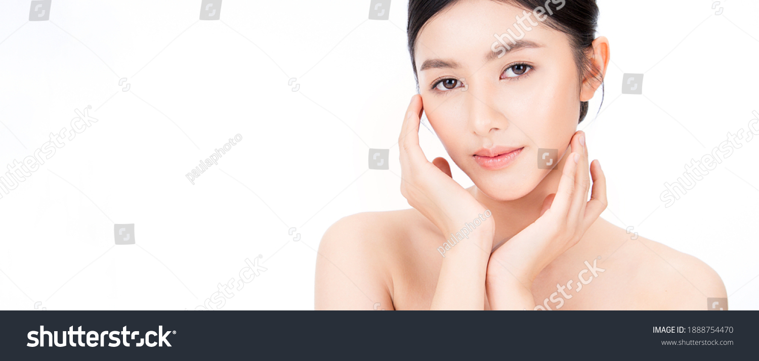 Closeup portrait of beauty asian woman with fair perfect healthy glow skin hand touching cheek isolated on white, young beautiful asia girl with pretty smile on face. Beauty korean spa skincare banner #1888754470