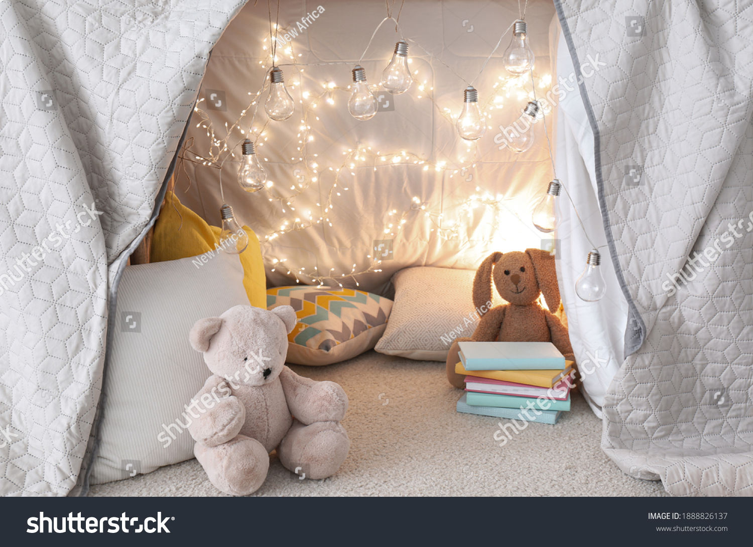 Play tent with toys and pillows indoors, closeup. Modern children's room interior #1888826137