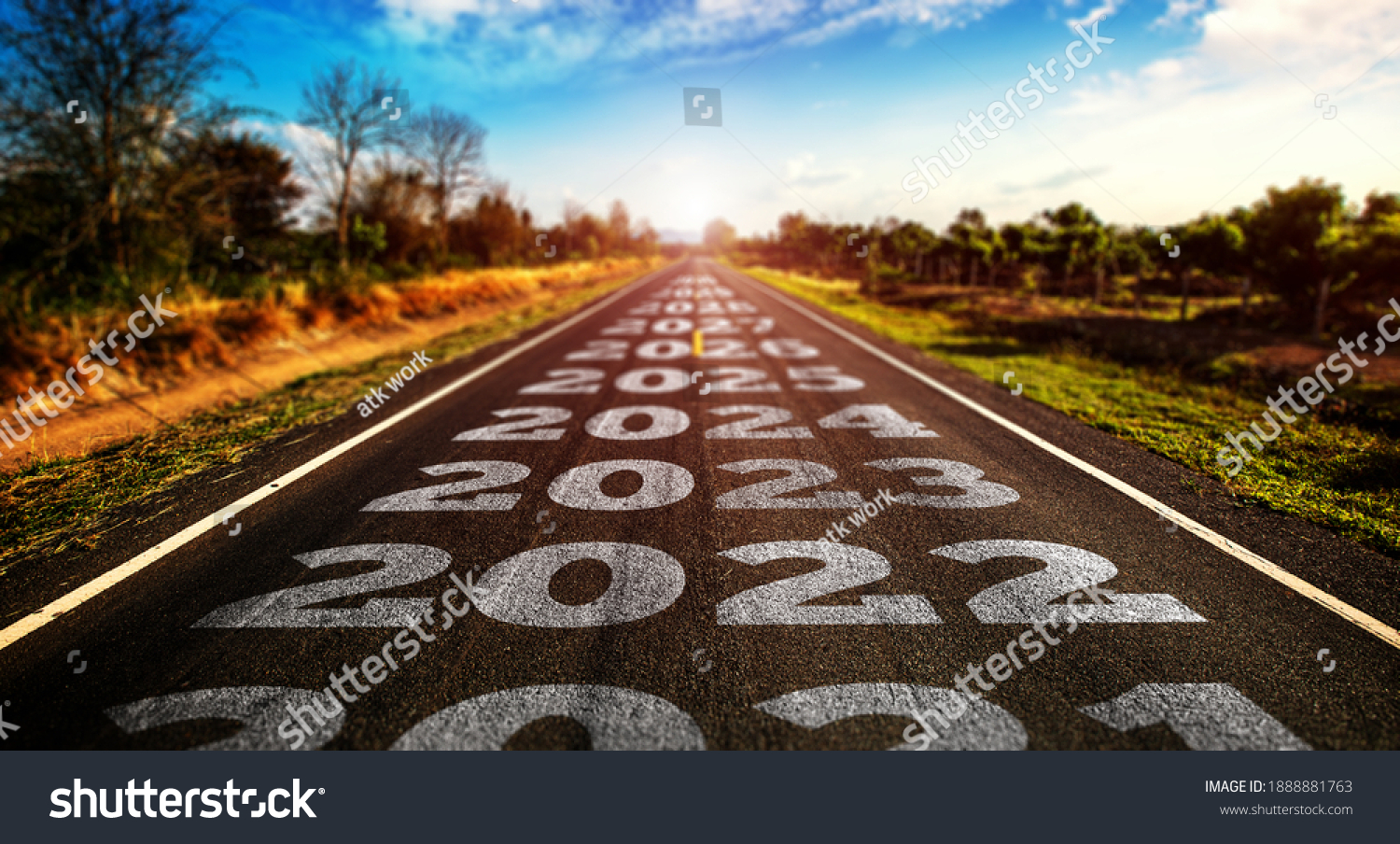 2021-2025 written on highway road in the middle of empty asphalt road and beautiful blue sky. Concept for vision 2021-2025. #1888881763