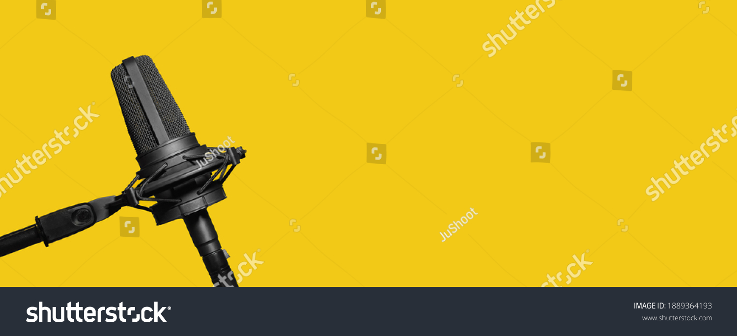 Professional microphone isolated on yellow background, podcast or website banner with copy space #1889364193