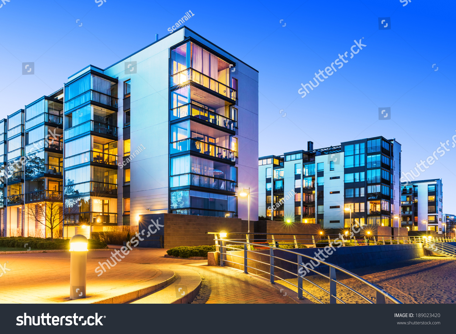 House building and city construction concept: evening outdoor urban view of modern real estate homes #189023420
