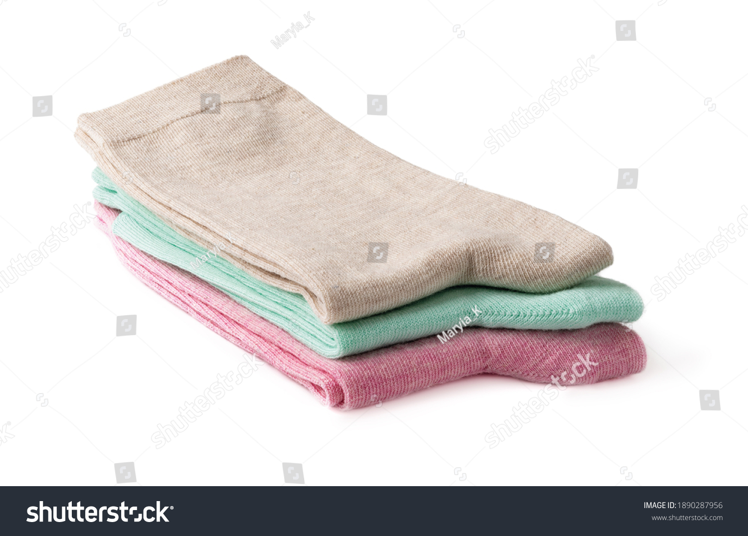 Stack of new tall colorful socks isolated on a white background. Three pairs of beige, green and pink socks folded in half. Elastic cotton hosiery. Full depth of field. Front view. #1890287956