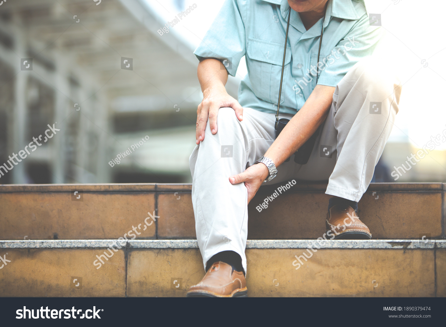unhappy senior man suffering from knee ache. Travel and tourism concept.health problem and people concept.  #1890379474