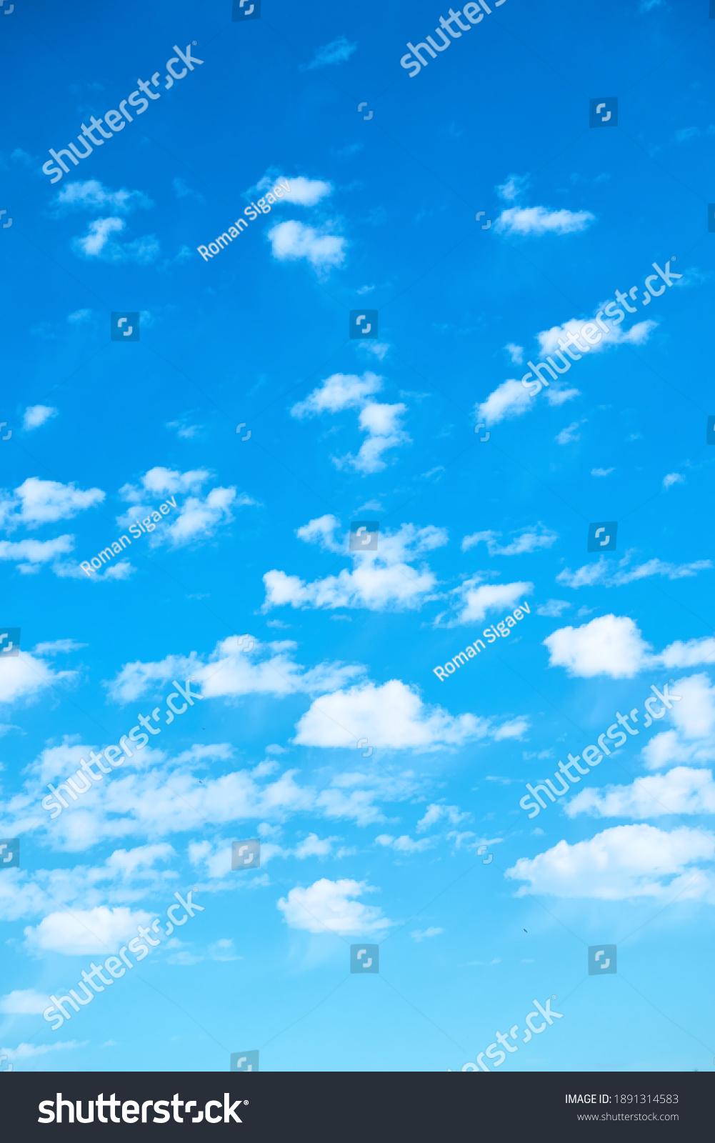 Blue sky with multitude of white clouds - vertical background #1891314583
