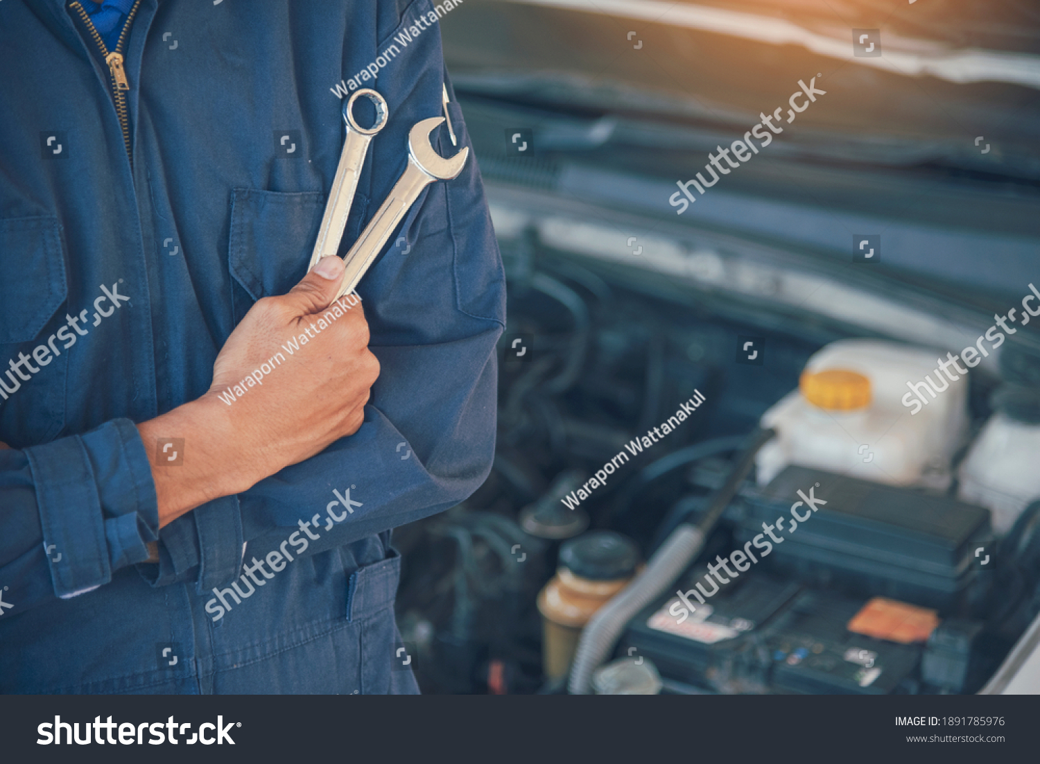 Mechanic overhaul technician car auto garage automotive mobile center. Technician overhaul workshop repairing engine motor vehicles service mechanical business. Automobile mechanic hands car repairs #1891785976