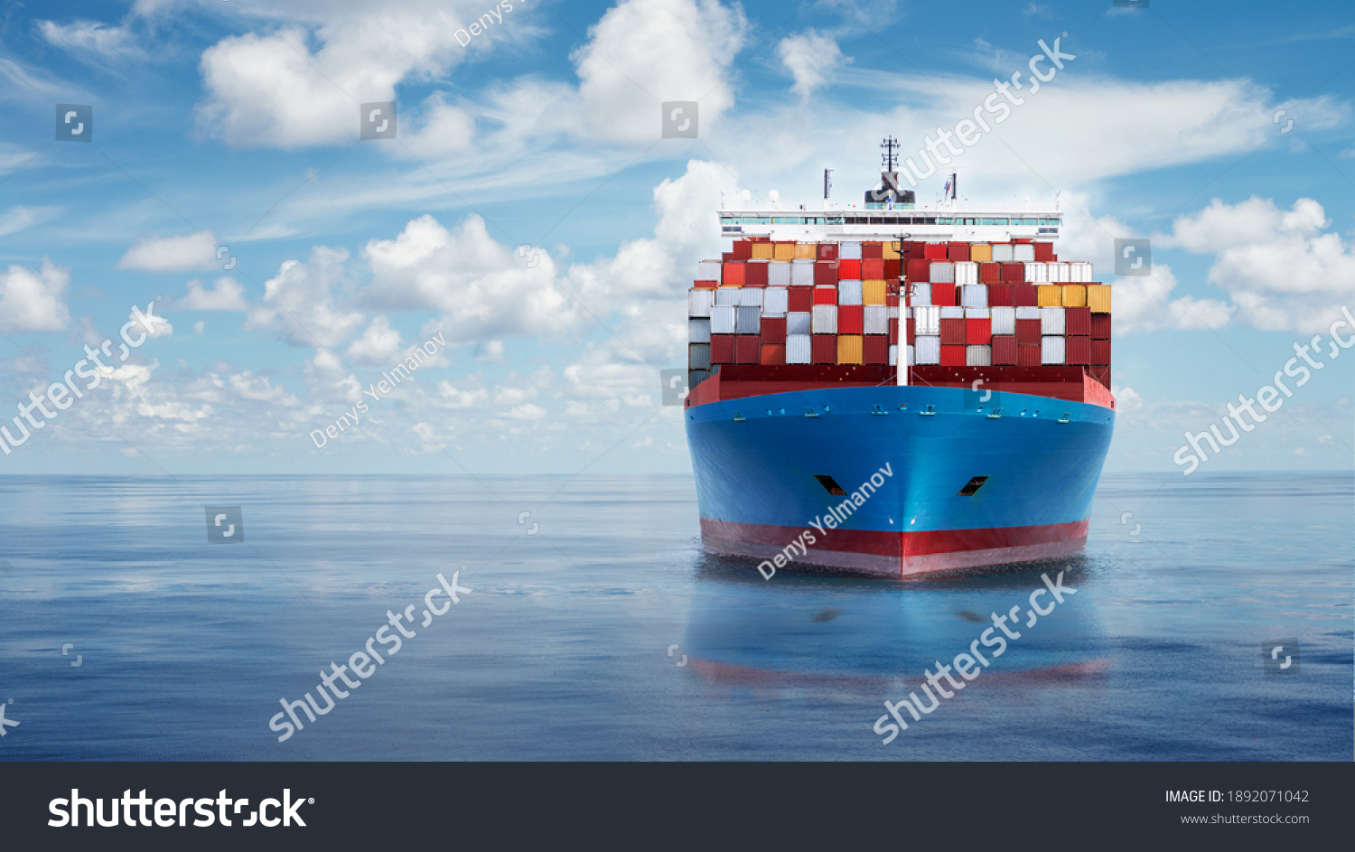 Front view from bow of a large blue shipping container ship in the ocean. #1892071042