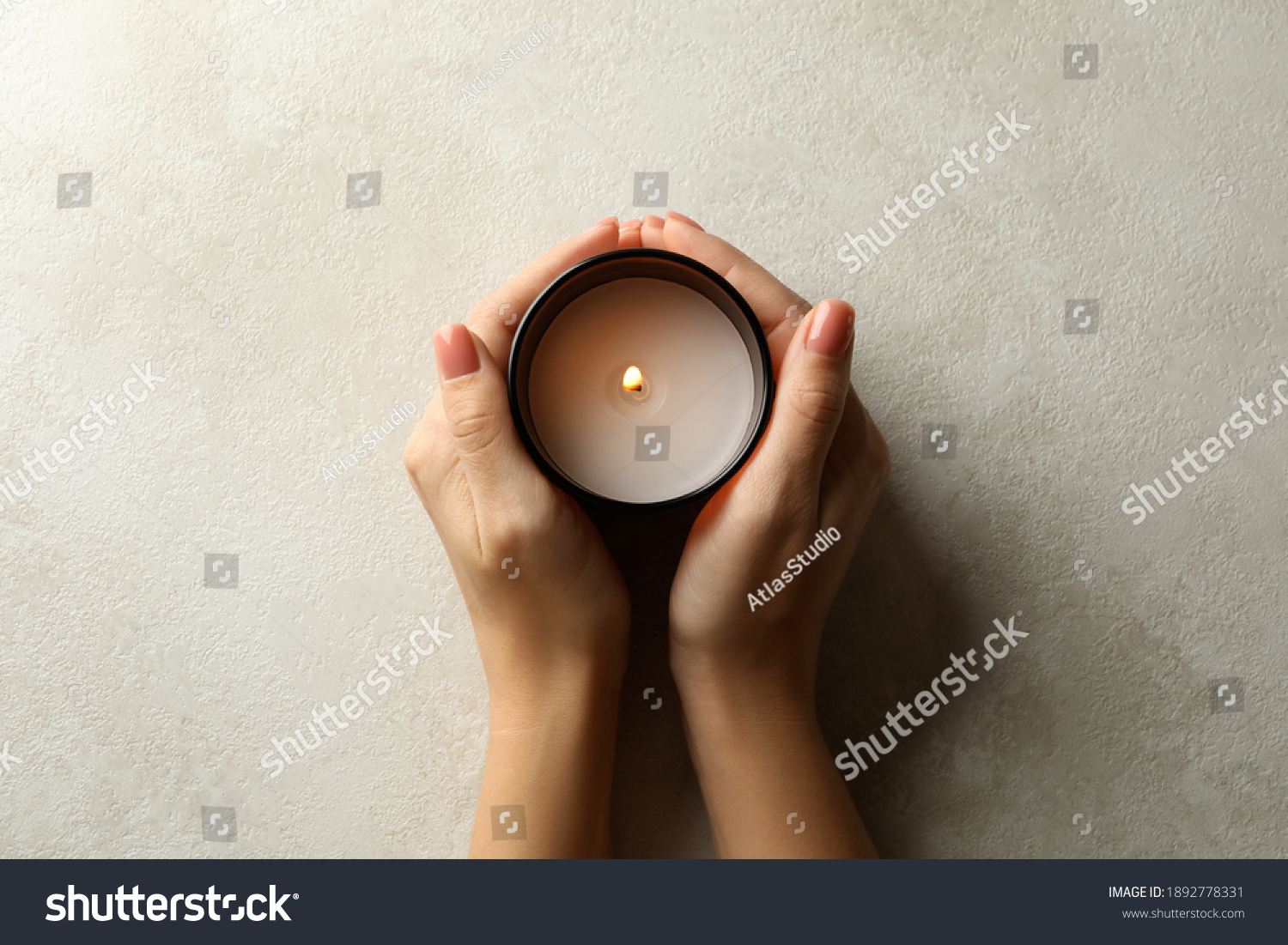 Female hands holding scented candle, top view #1892778331