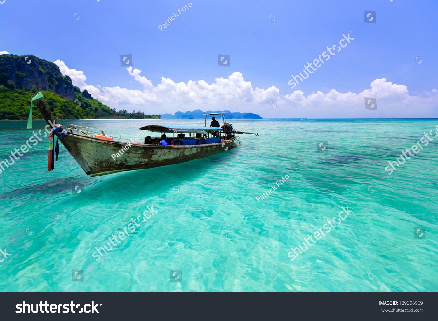 Wooden boat and blue water ocean, Krabi Thailand #189306959