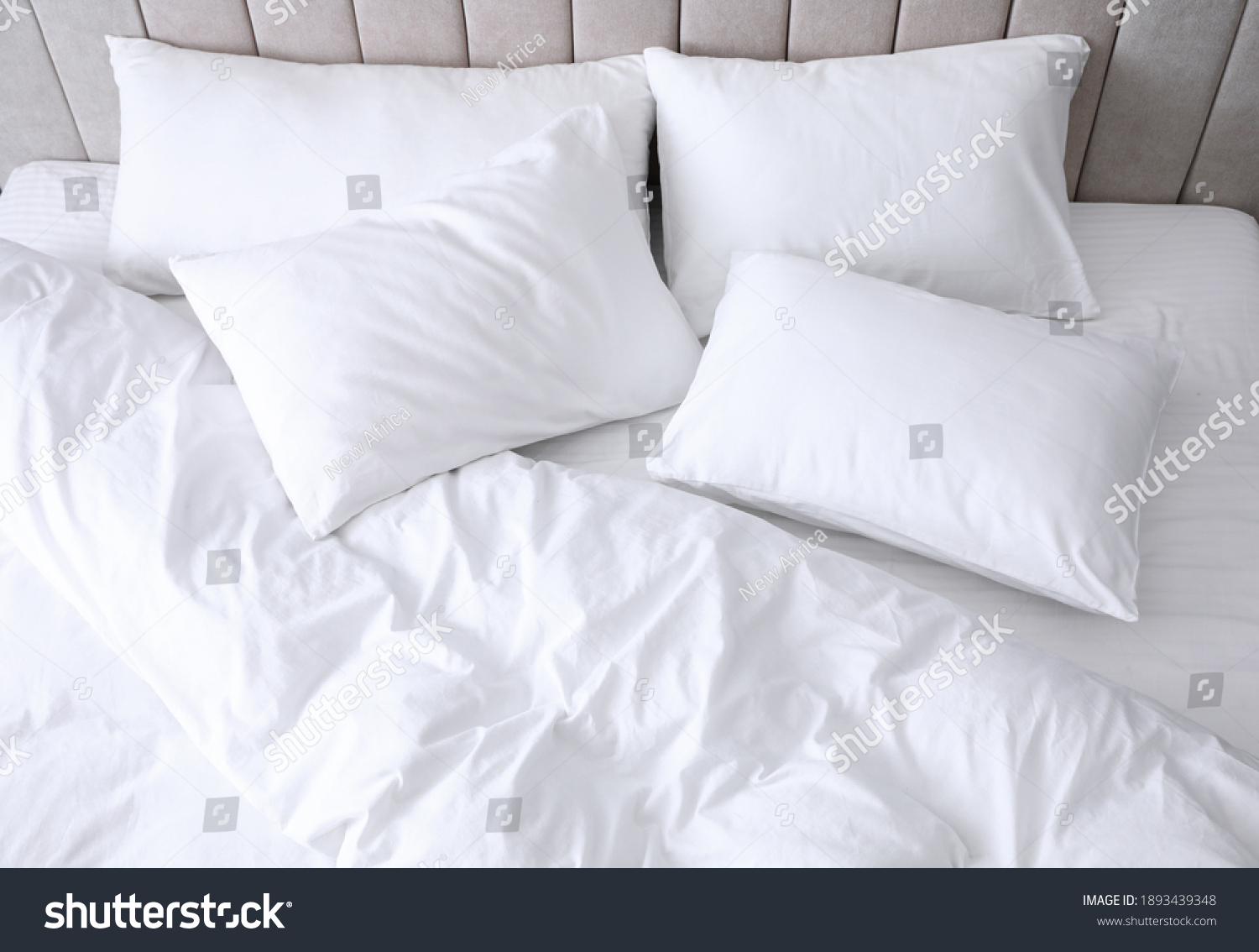 Comfortable bed with soft white pillows, closeup #1893439348