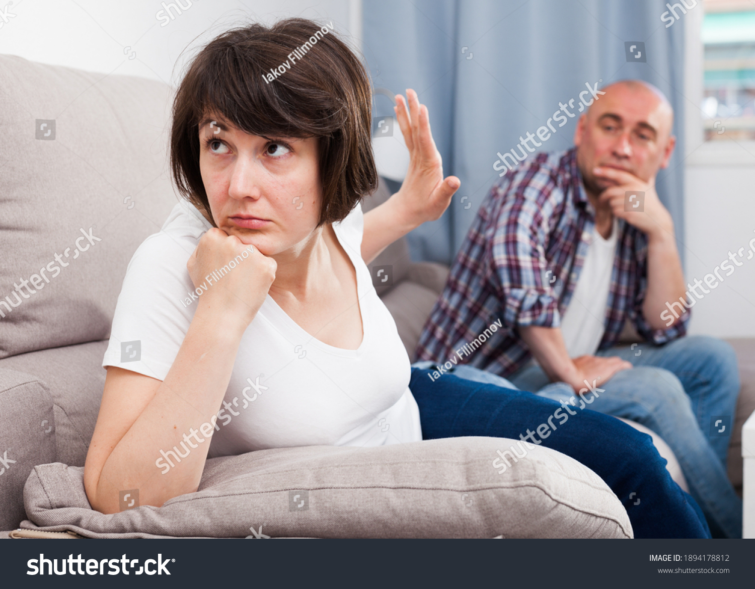 Quarrel between husband and wife in the apartment. High quality photo #1894178812