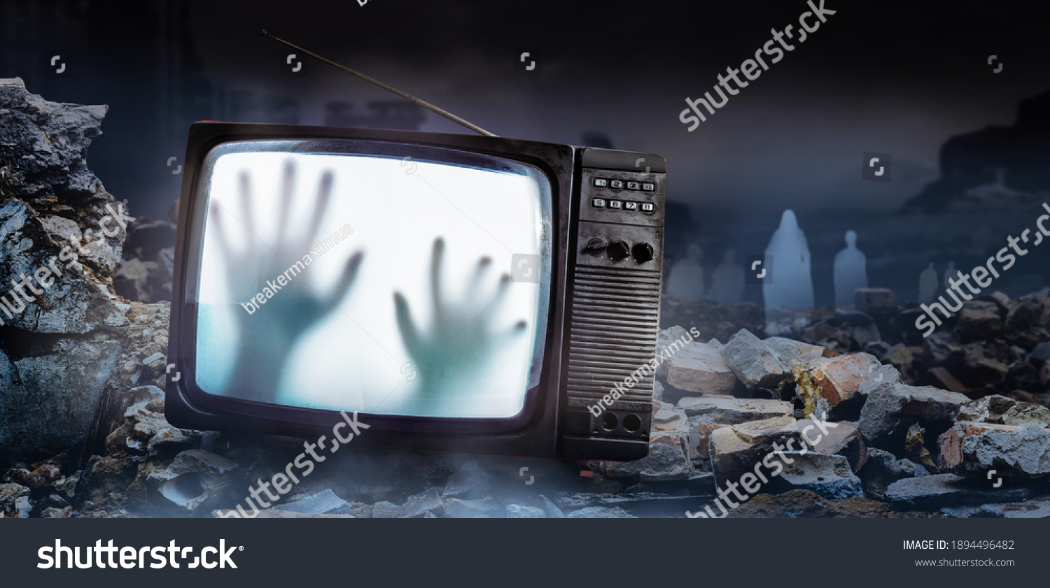 Horror photo of an old black  scary haunted tv set with ghost hands on screen, standing on dark foggy ruined city with spirit figures background. #1894496482