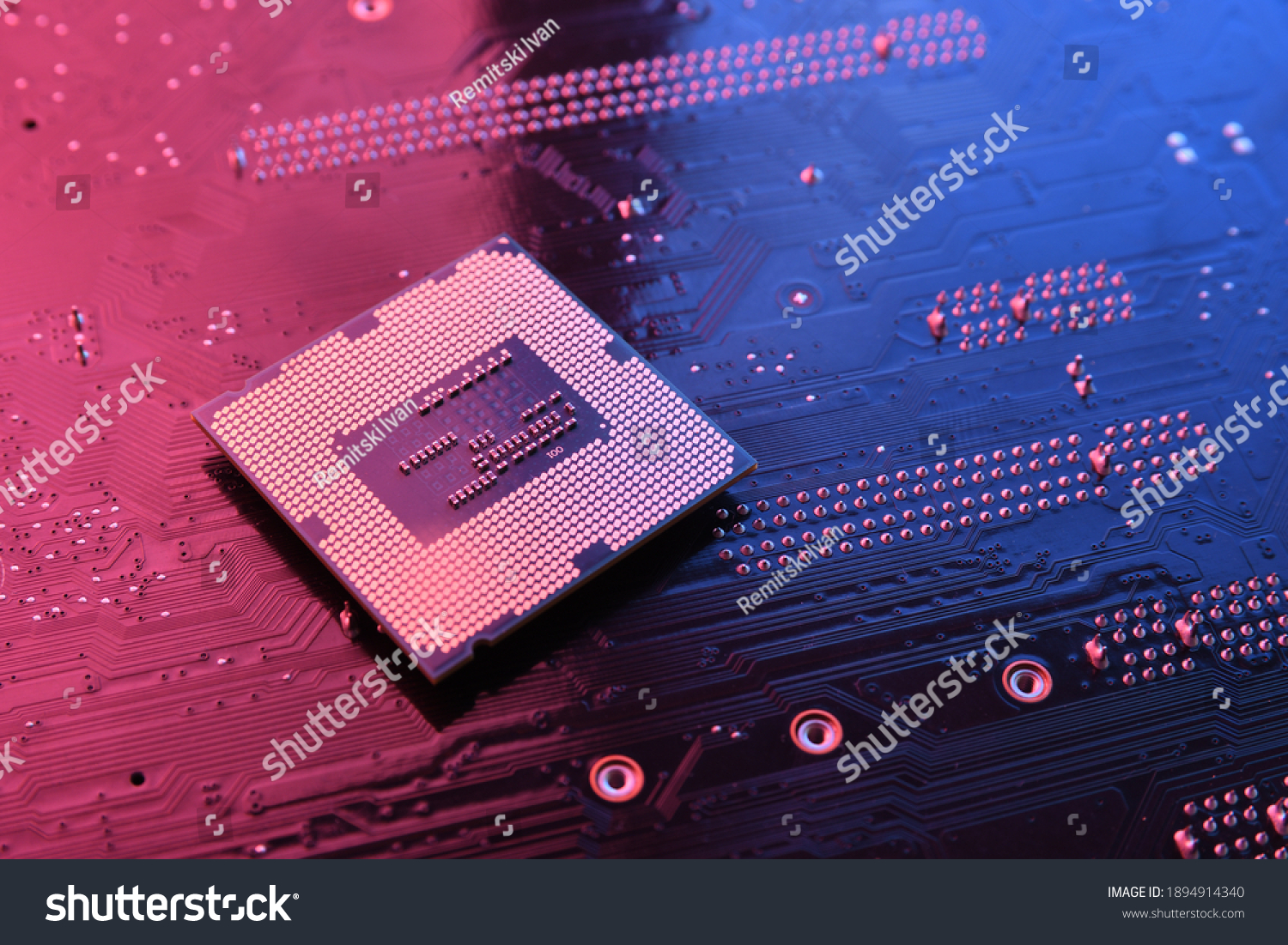 Computer cpu processor chip on circuit board ,motherboard background. Close-up. With red-blue lighting. #1894914340