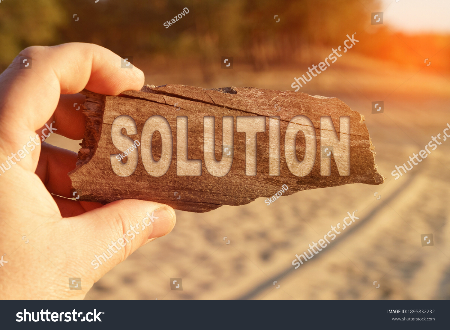 Business and miscellaneous concept. A man holds a sign in his hands - SOLUTION #1895832232