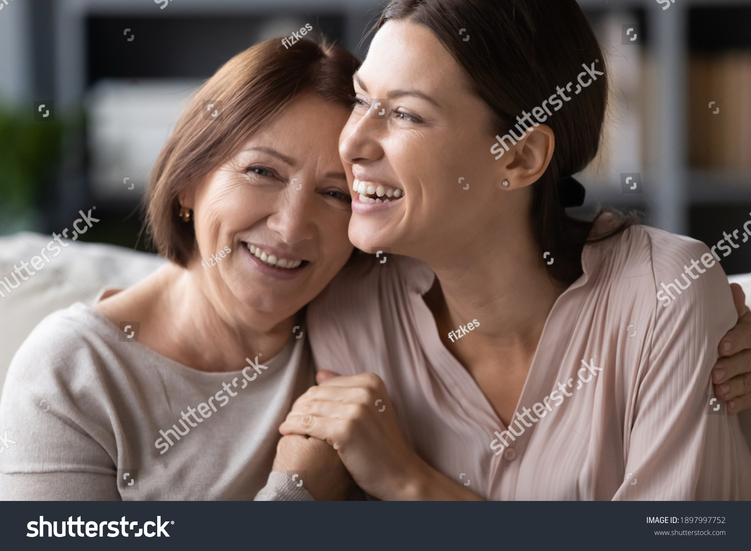 Close up head shot portrait smiling mature mother and grownup daughter cuddling, family enjoying tender moment, happy young woman with elderly mum hugging, spending leisure time together #1897997752