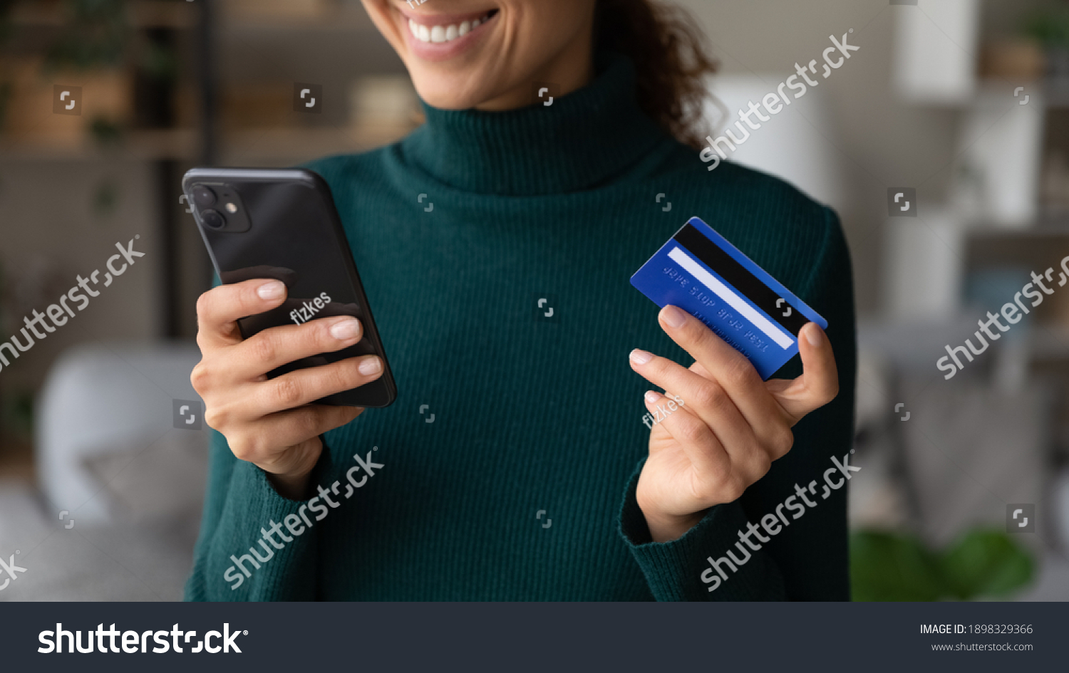 Close up of excited young Caucasian woman hold smartphone shop online with credit card. Happy female client or buyer pay buy on internet with cellphone using secure banking system on gadget. #1898329366