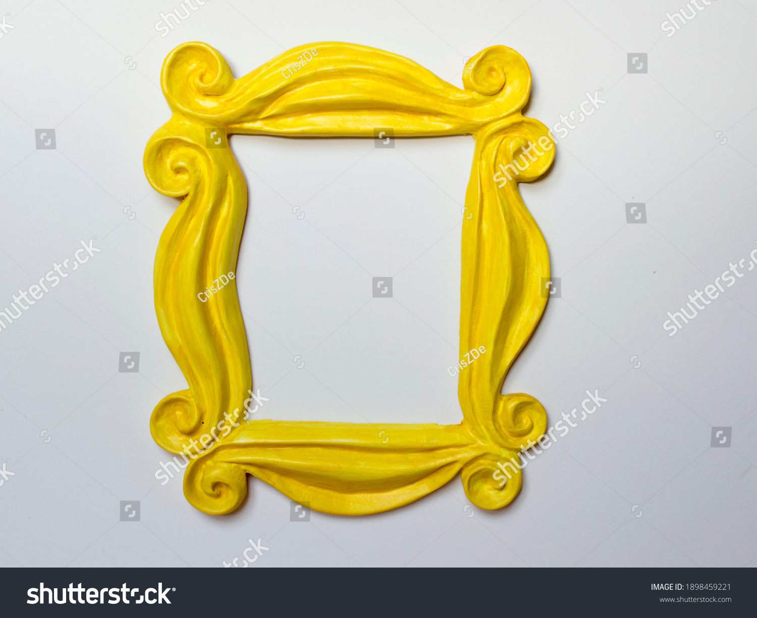 Yellow photo frame or mirror frame with a white background, to frame texts or images. #1898459221