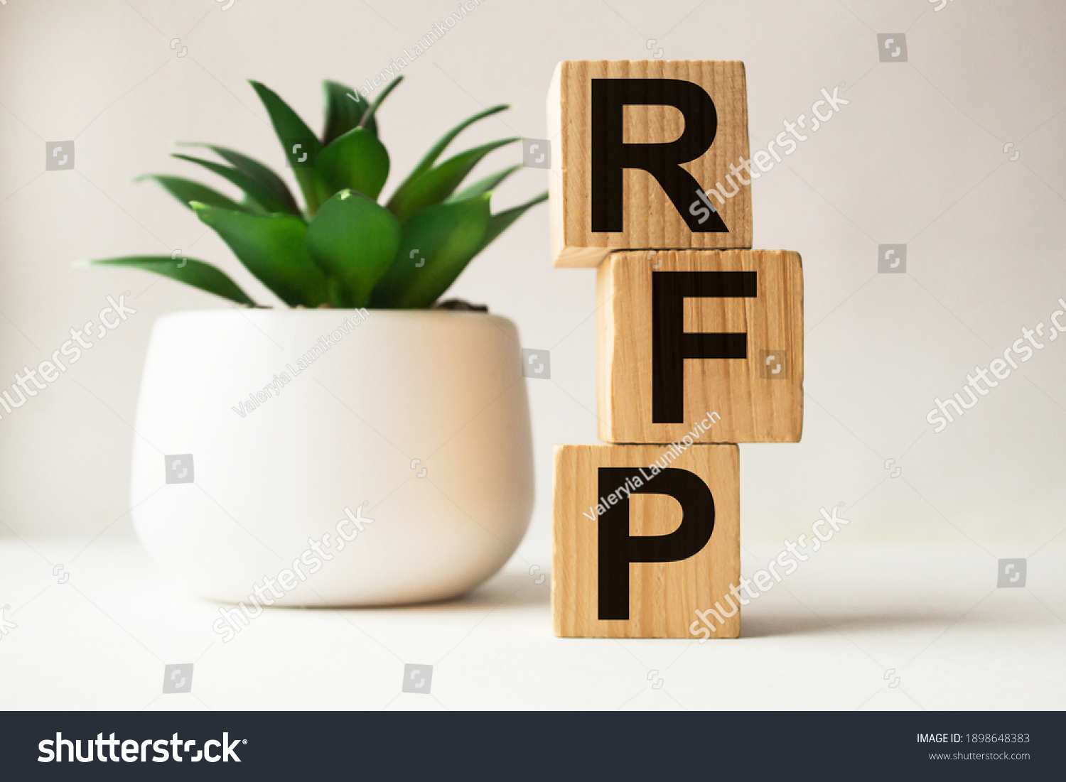 a word RFP on wooden cubes. business concept. business and Finance #1898648383