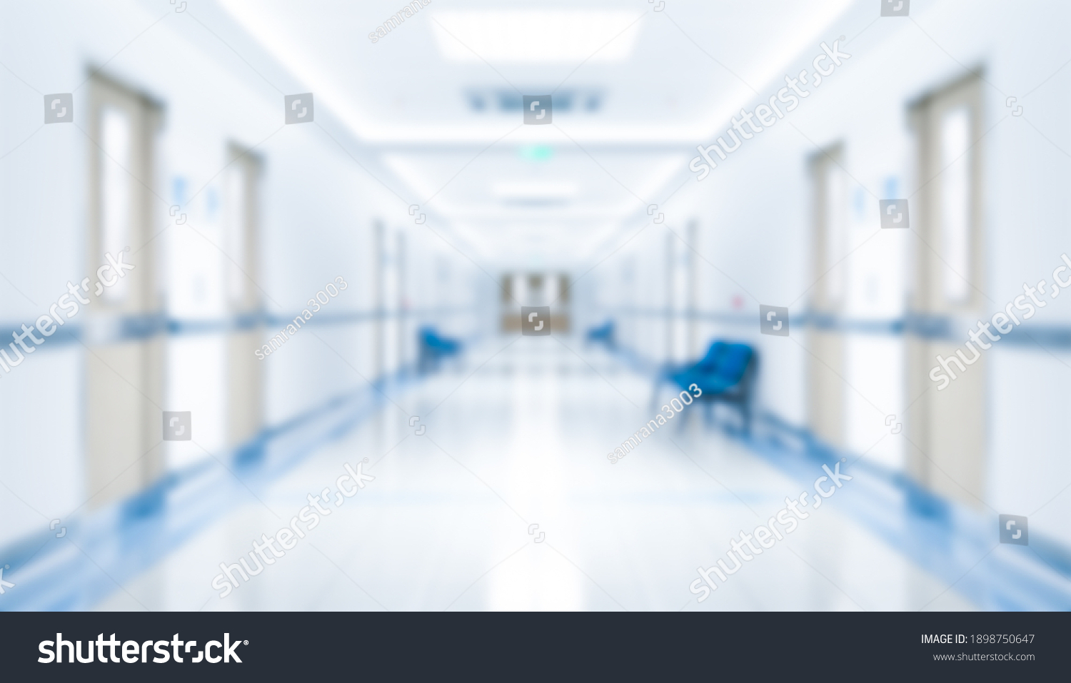 Long hospital bright corridor with rooms and seats 3D rendering #1898750647