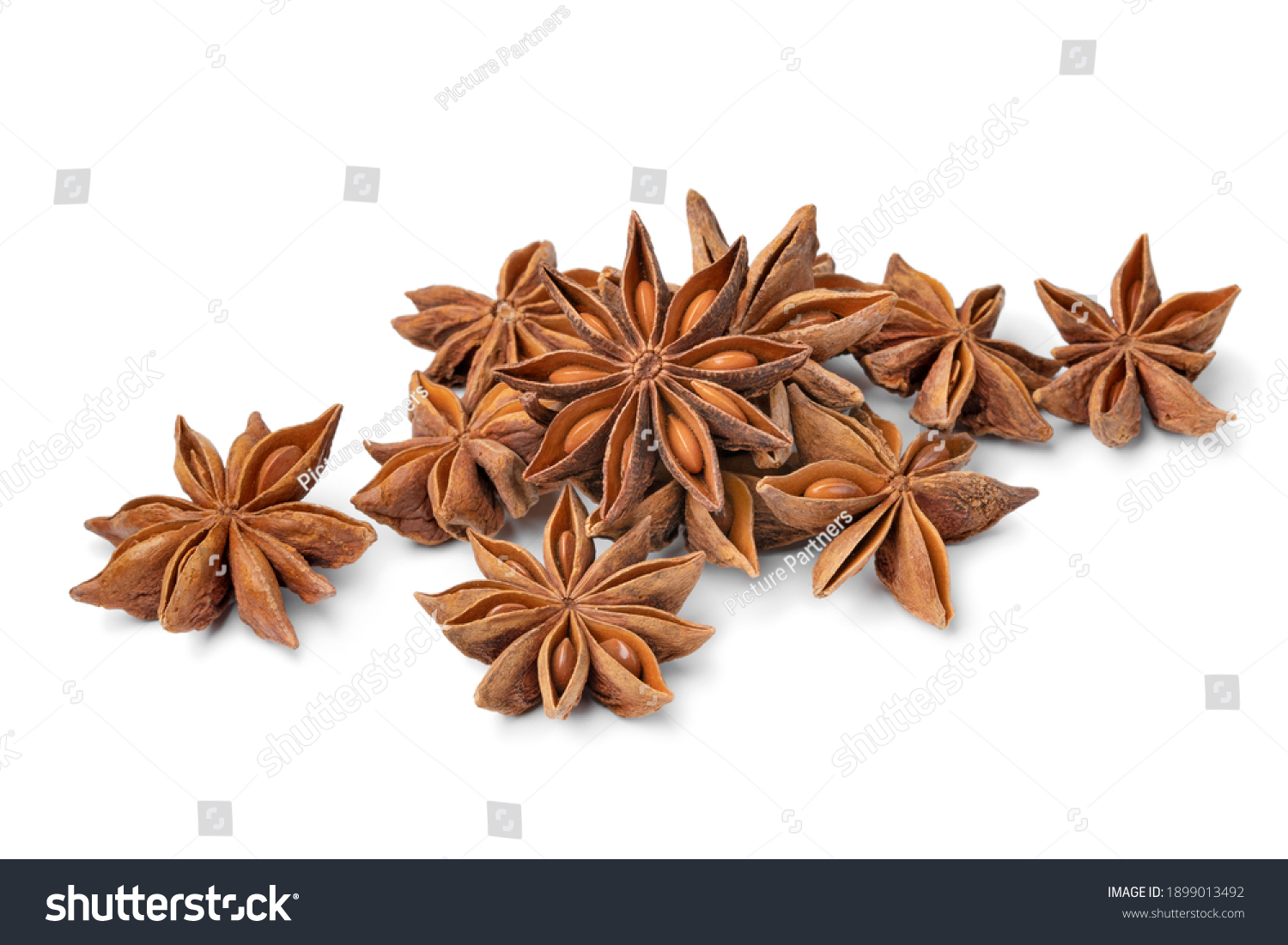Heap of dried star anise close up isolated on white background  #1899013492