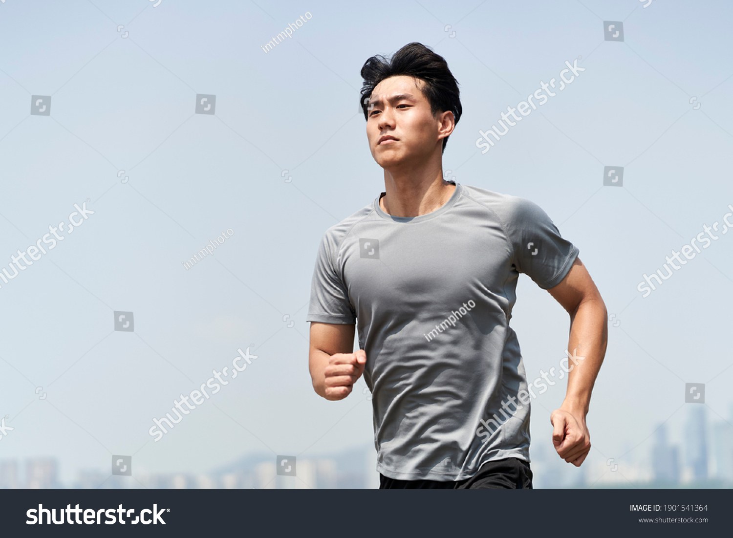 young asian man male runner jogger running jogging outdoors #1901541364
