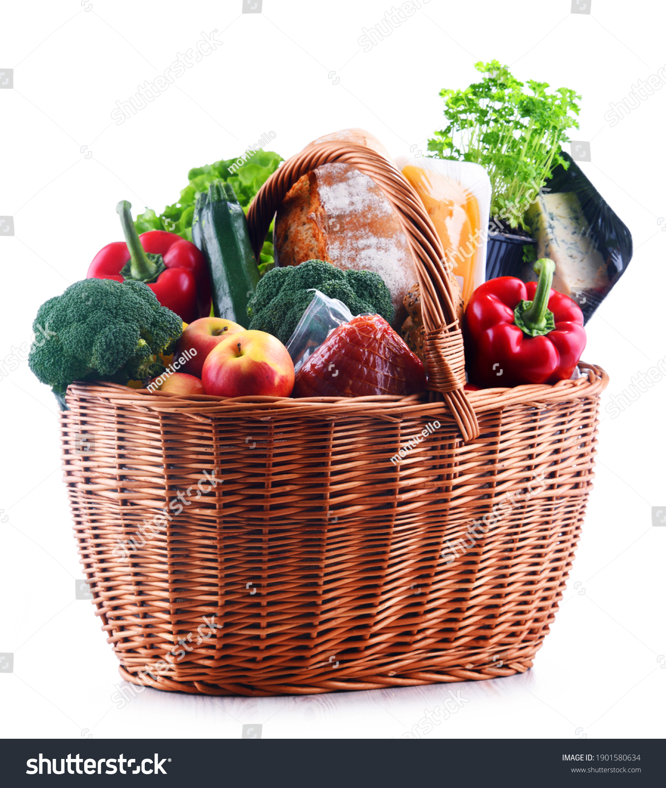 Wicker basket with assorted grocery products isolated on white background #1901580634