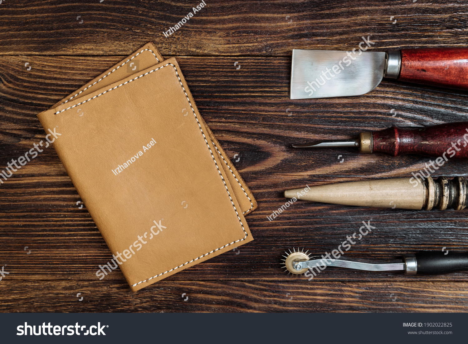handmade leather wallet with tools from the workshop. genuine leather accessory #1902022825
