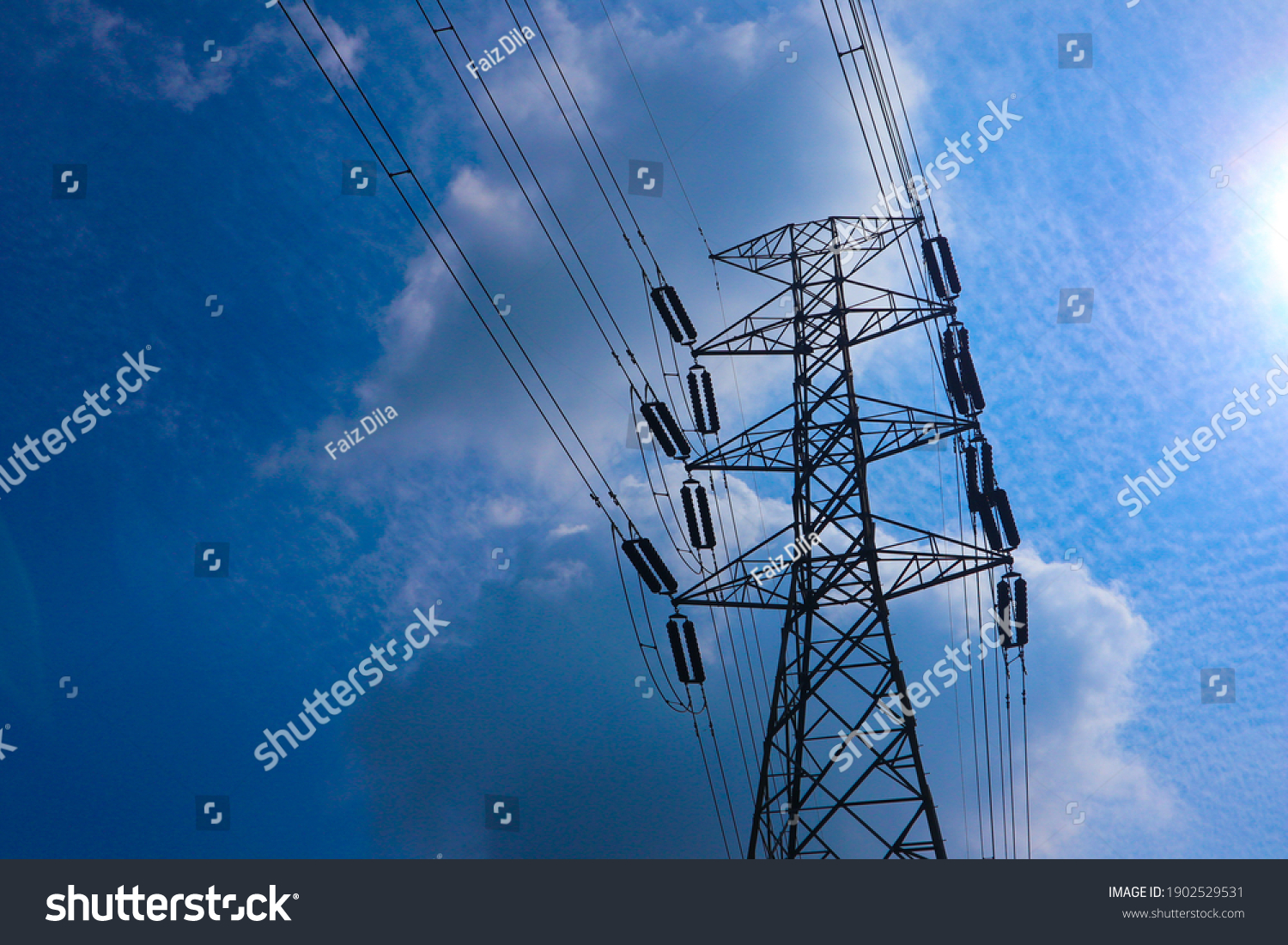  the pylon outline, Very High Voltage Power Lines (Indonesia : SUTET) on blue sky
 #1902529531