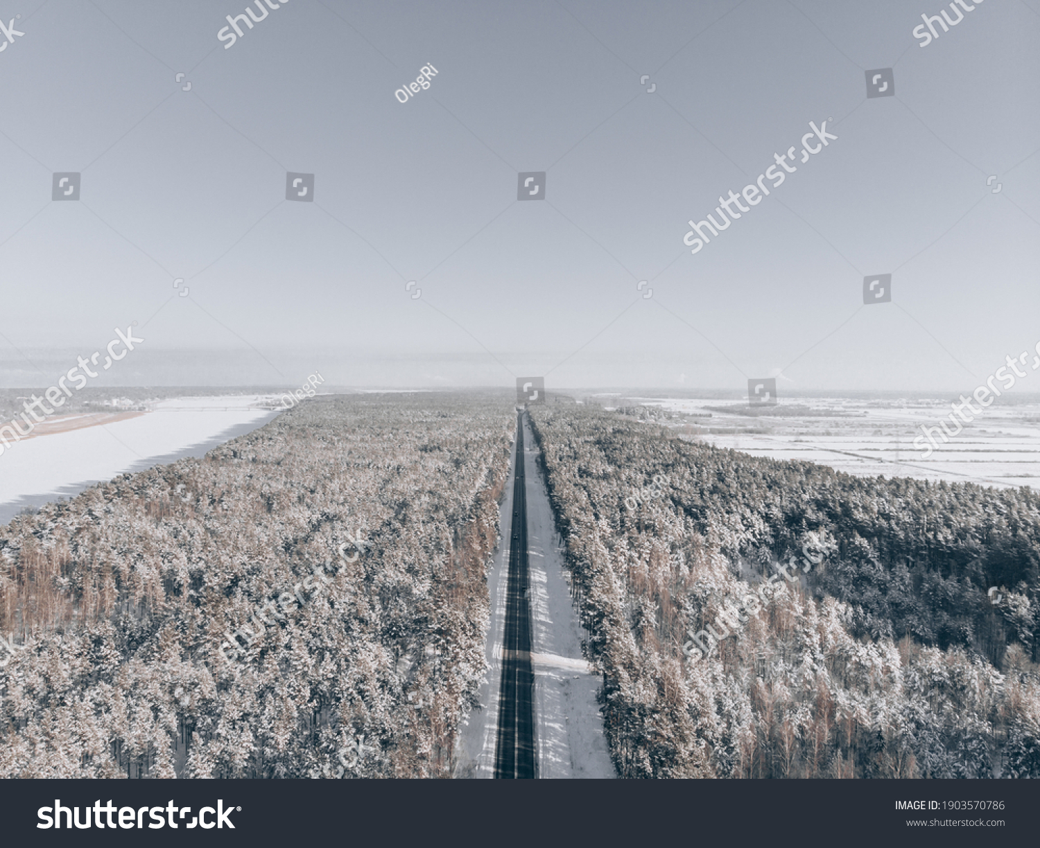 snow road in forest. View at road from sky #1903570786