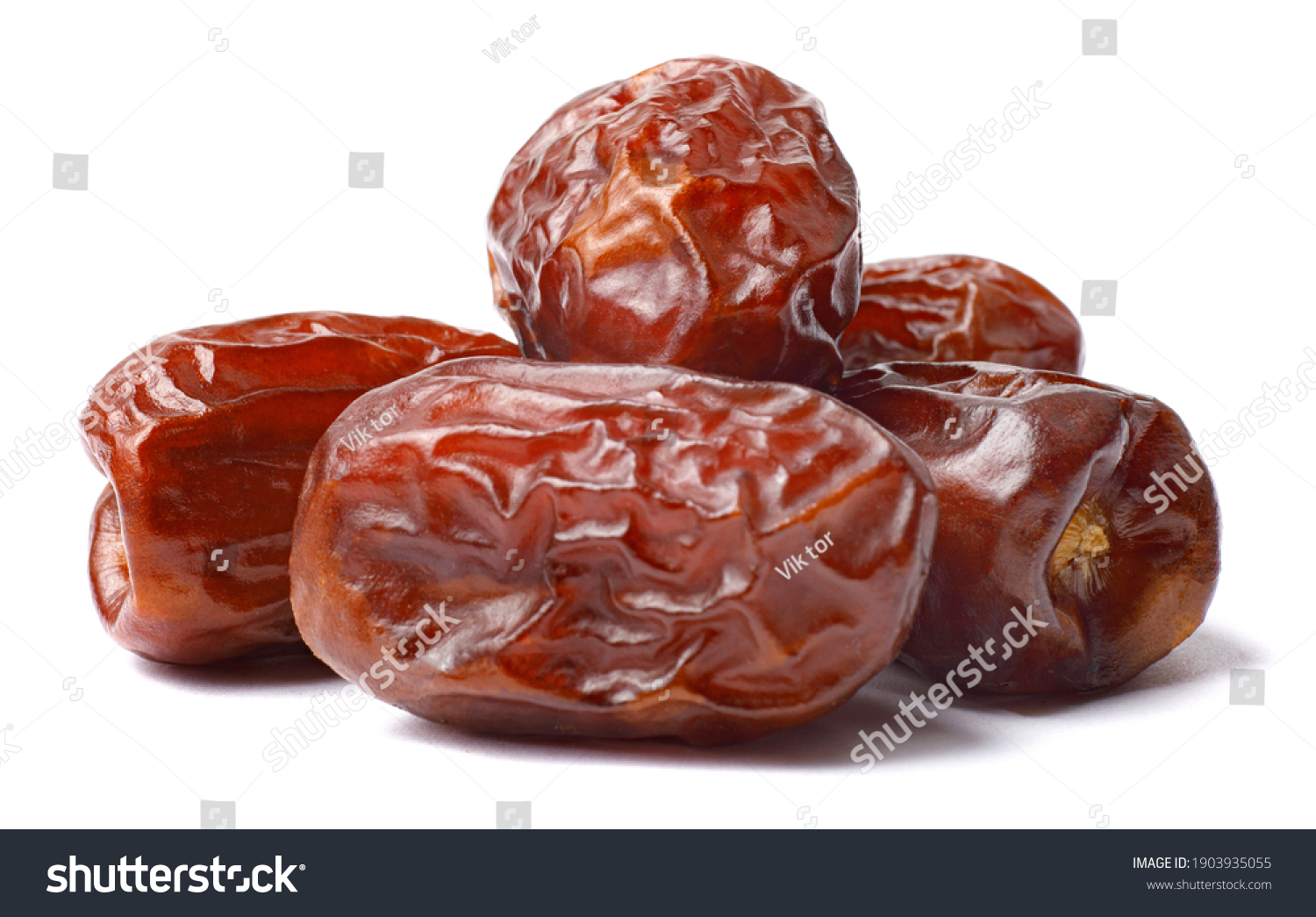 Pile of tasty dry dates isolated on white background. Arabic food #1903935055
