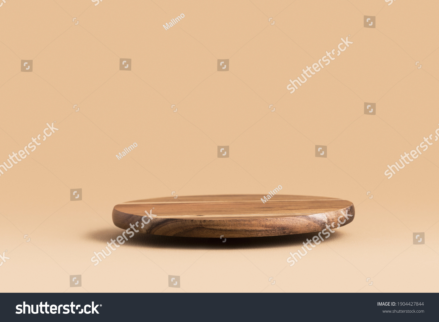 Round wooden podium for food, products or cosmetics against bright brown background. #1904427844