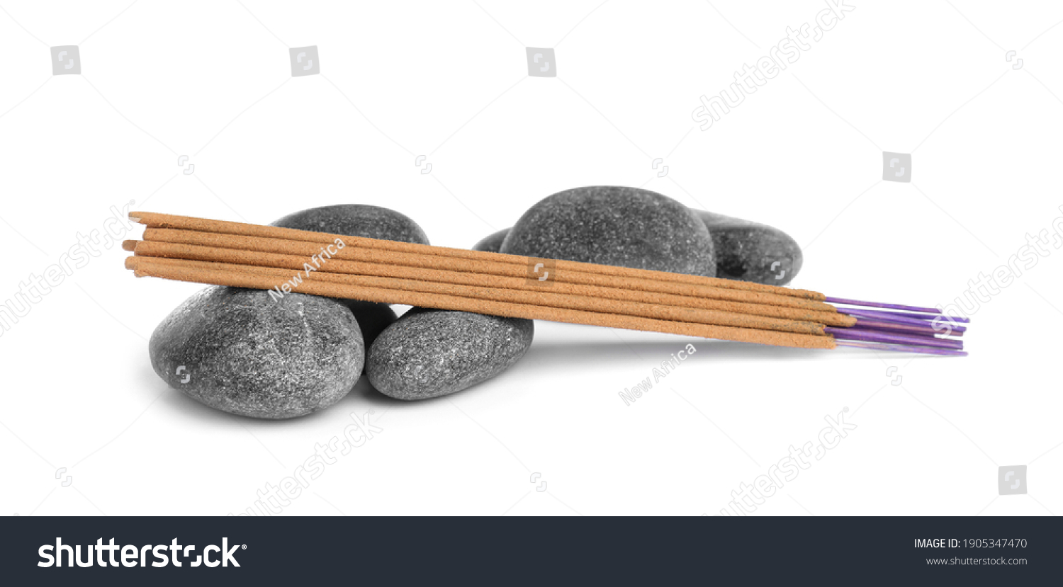 Aromatic incense sticks and spa stones on white background #1905347470