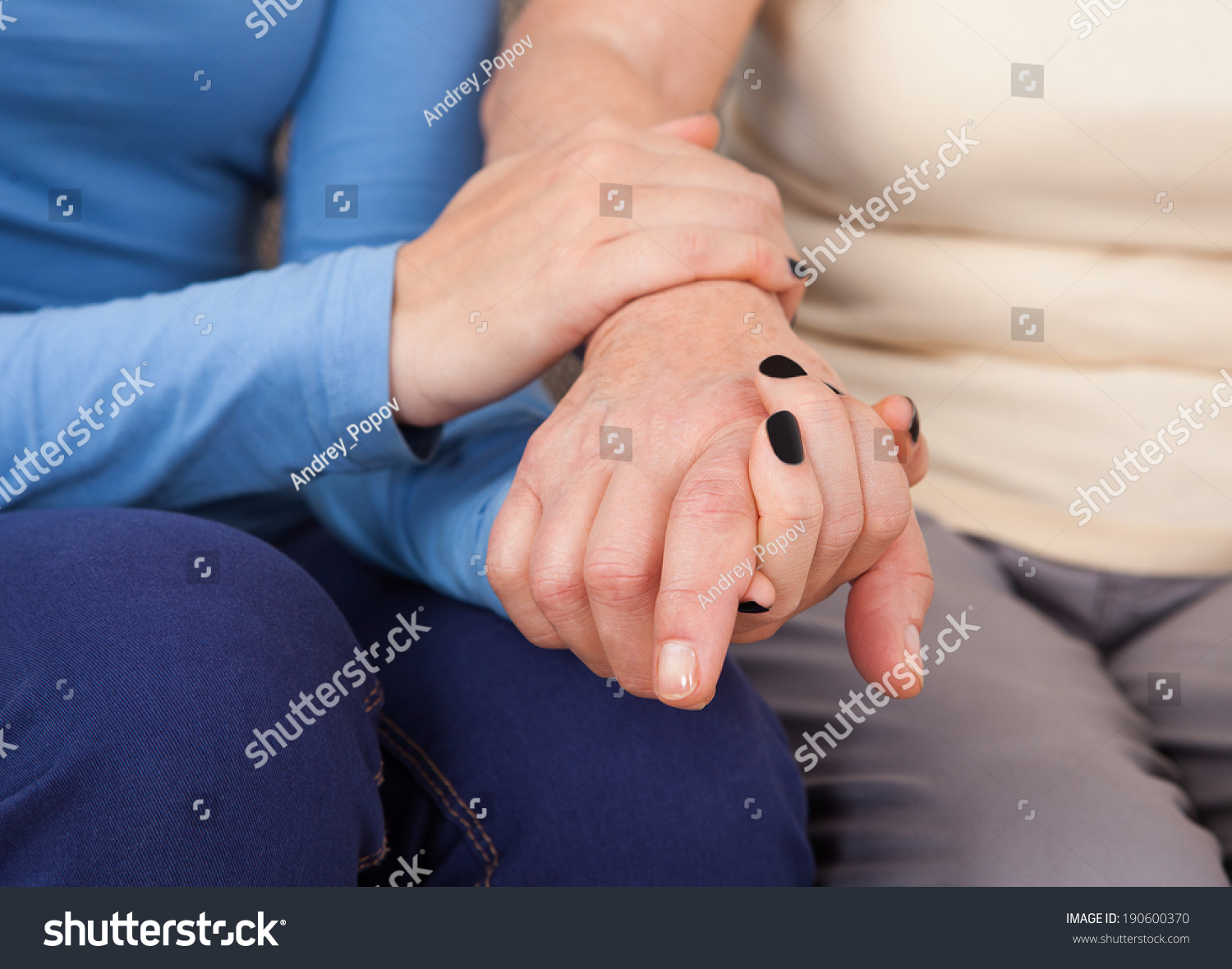 Midsection closeup of female caregiver consoling senior woman #190600370