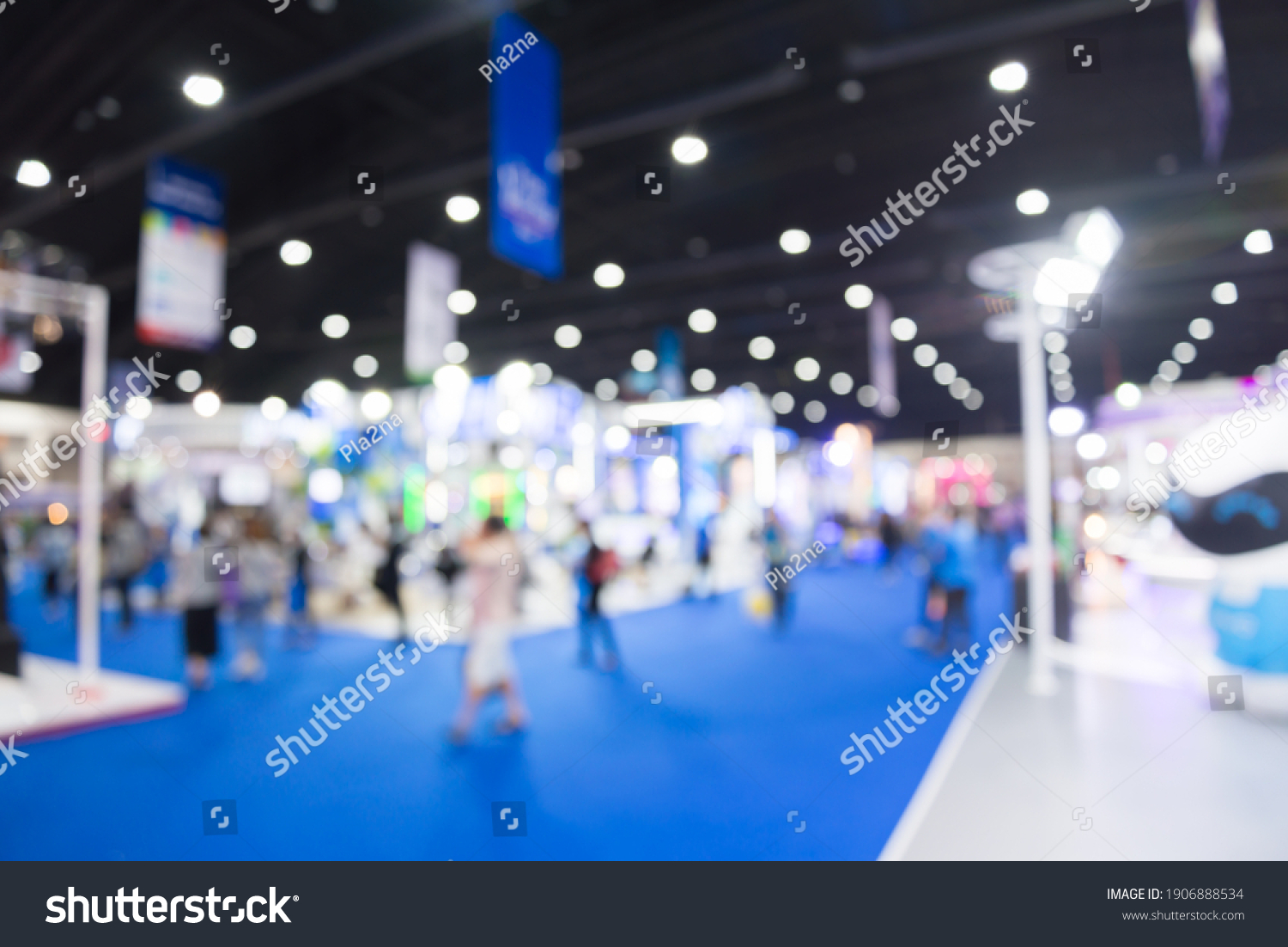 Abstract blur people in exhibition hall event trade show expo background. Large international exhibition, convention center, business marketing and event fair organizer concept. #1906888534