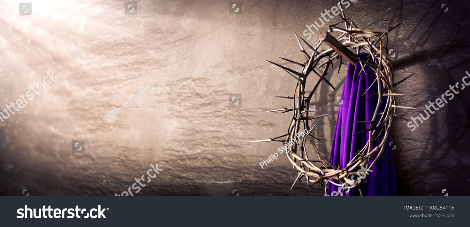 Crown Of Thorns And Purple Robe Hanging On Nail In Stone Wall With Light Rays
 - Crucifixion Of Jesus Christ #1908254116