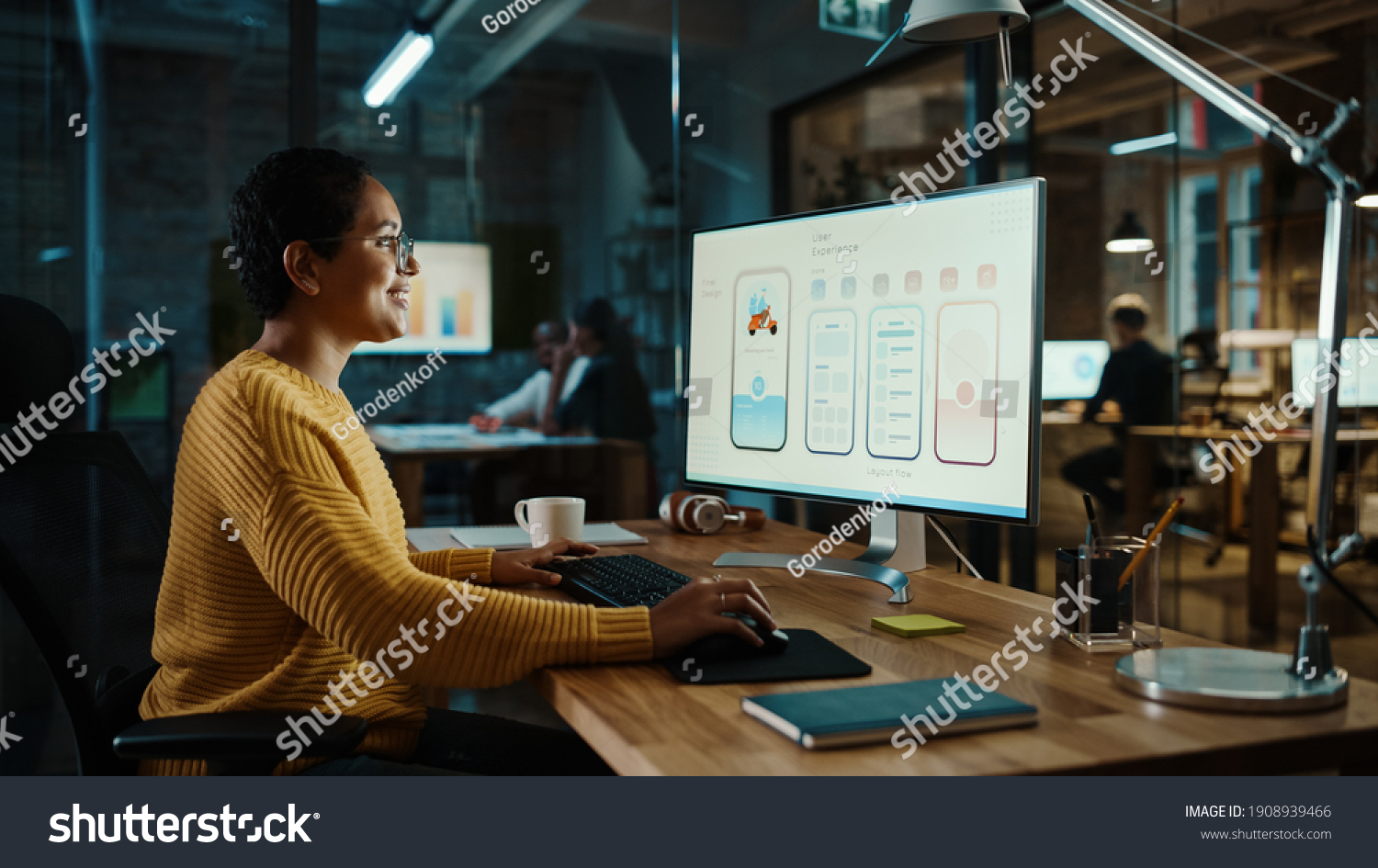 Young Latina Designer Working on a Desktop Computer in Creative Office. Beautiful Diverse Multiethnic Female is Developing a New App Design and User Interface in a Digital Graphics Editing Software. #1908939466