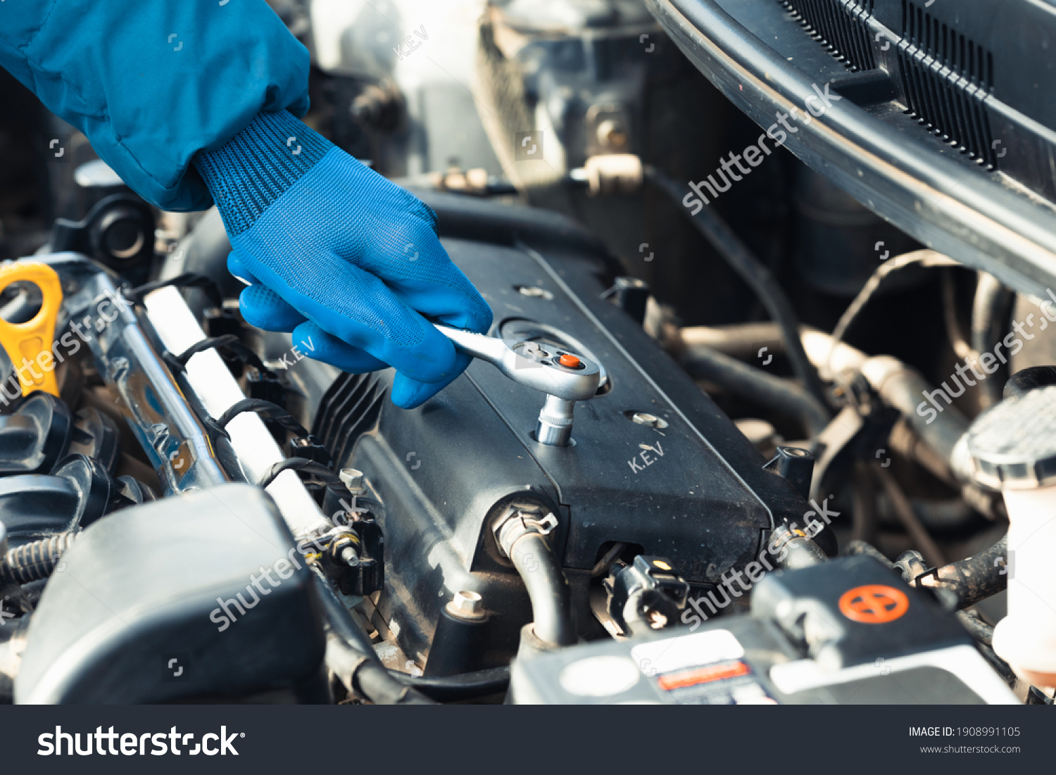 Car repair close up in auto repair shop #1908991105
