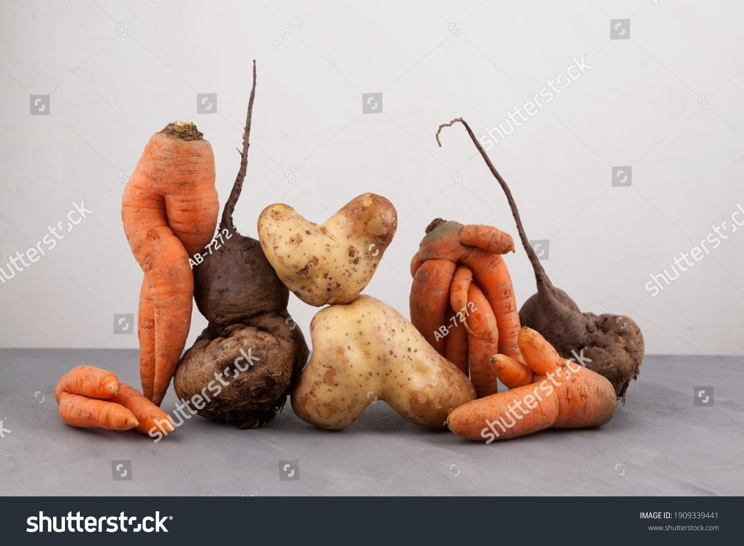 Ugly vegetables, side view, close-up. Concept - Food organic waste reduction. Using in cooking imperfect products. #1909339441