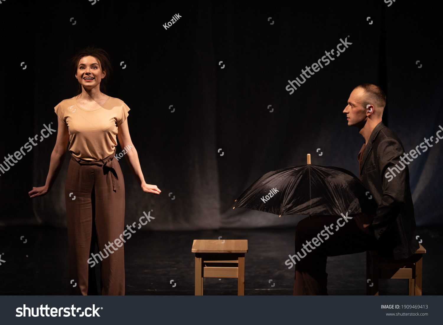Actors and actresses play a modern lyrical performance of the theater stage show #1909469413