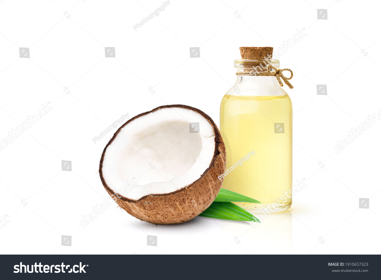 Coconut oil with coconut fruits cut in half isolated on white background. #1910657323