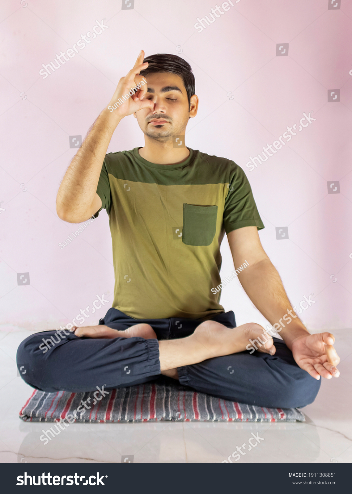 A young indian shredded teenage boy doing yoga - Royalty Free Stock ...