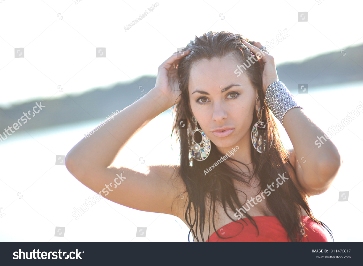 lifestyle photo of woman with perfect hair.walking alone at the beach.Sensual young girl relaxing.Colorful filter.glam style,teen trend outfit, positive mood,smiling,amazing model girl,long hair #1911476617