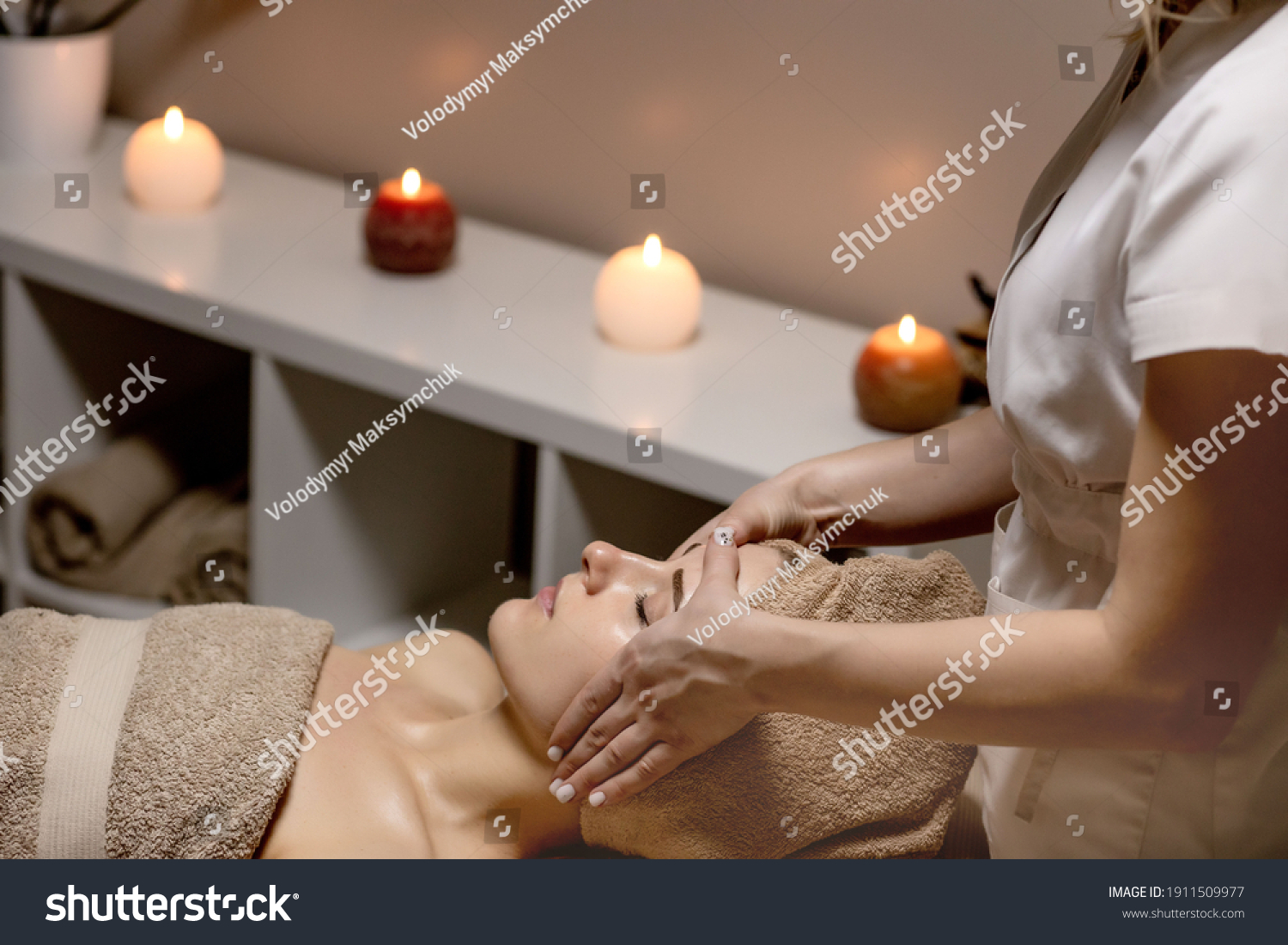 Relaxing massage. Woman receiving head massage at spa salon, side view. #1911509977