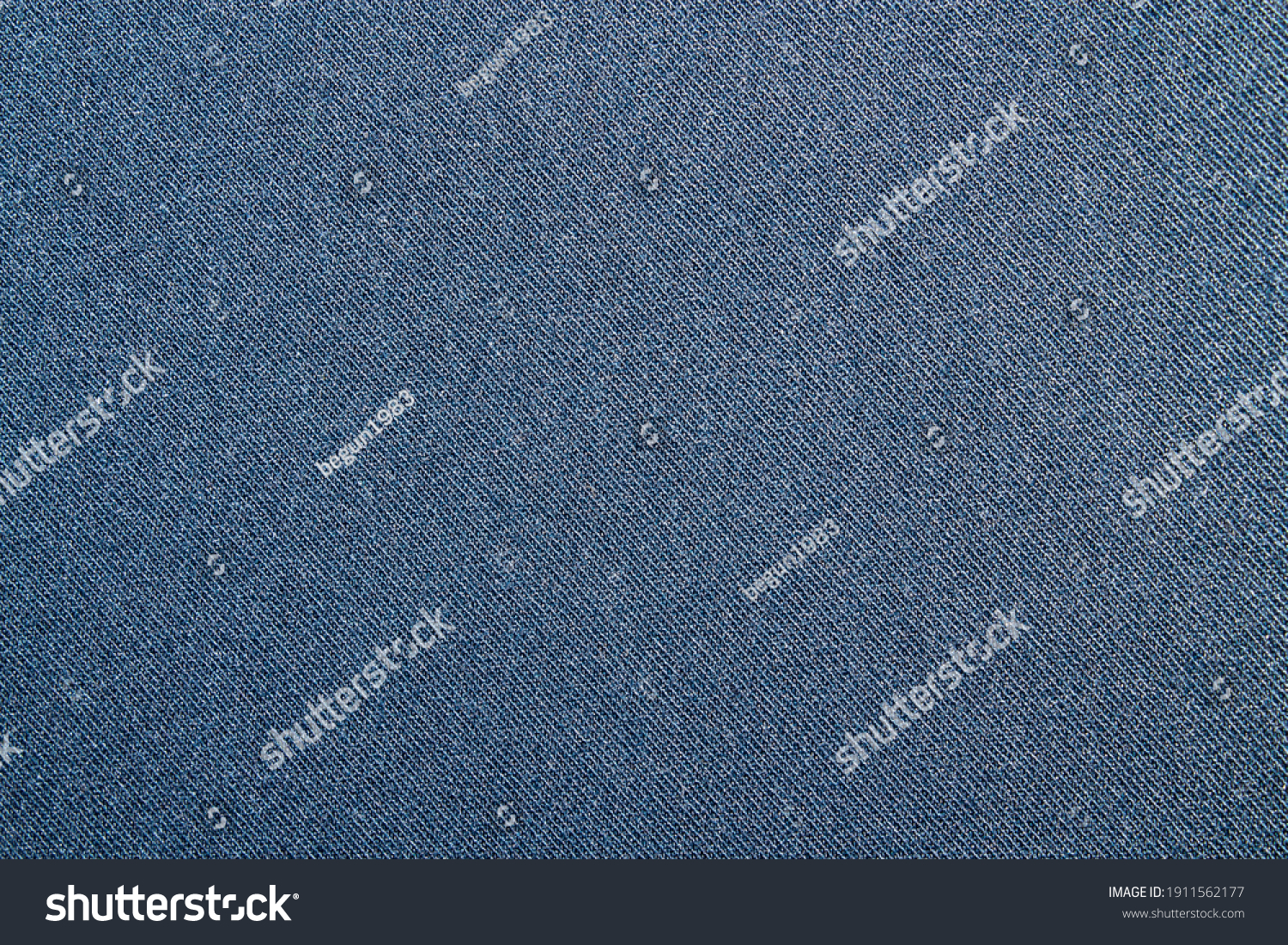 Dark blue tight denim background.Detailed texture of blue denim fabric with high resolution. #1911562177