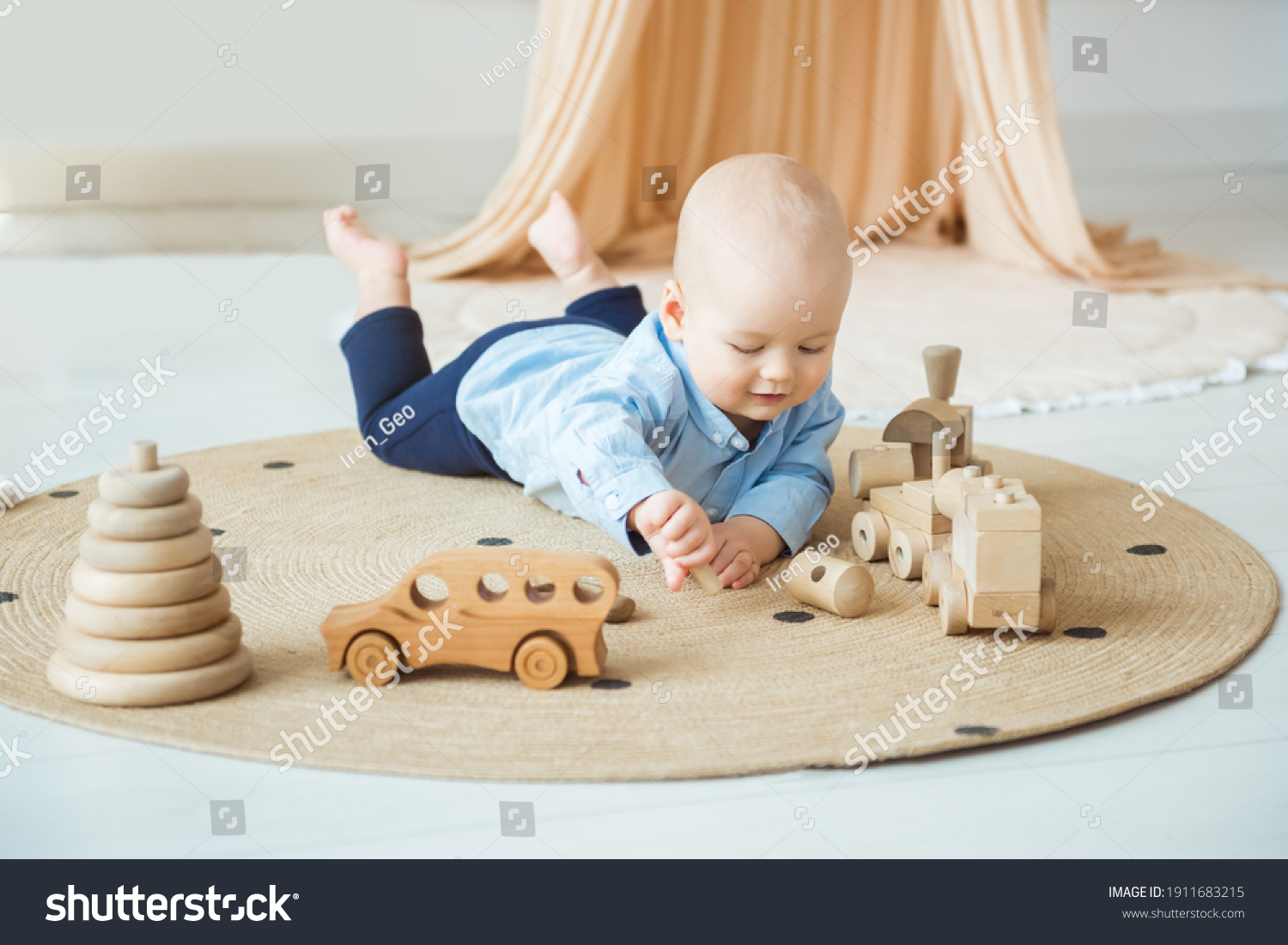 Baby playing with wooden toys. Eco-friendly wooden toys for children #1911683215