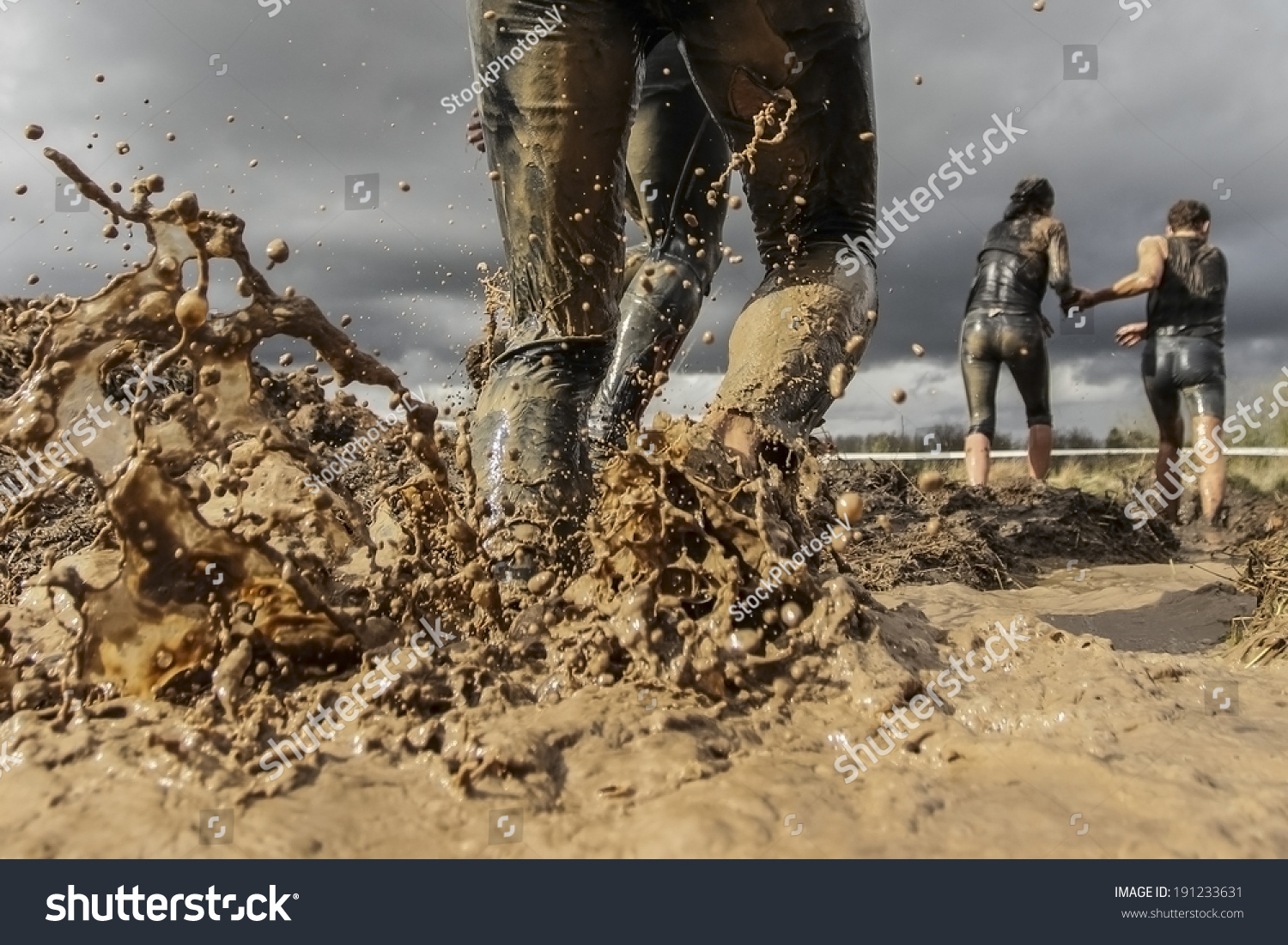 Mud race runner's muddy feet #191233631