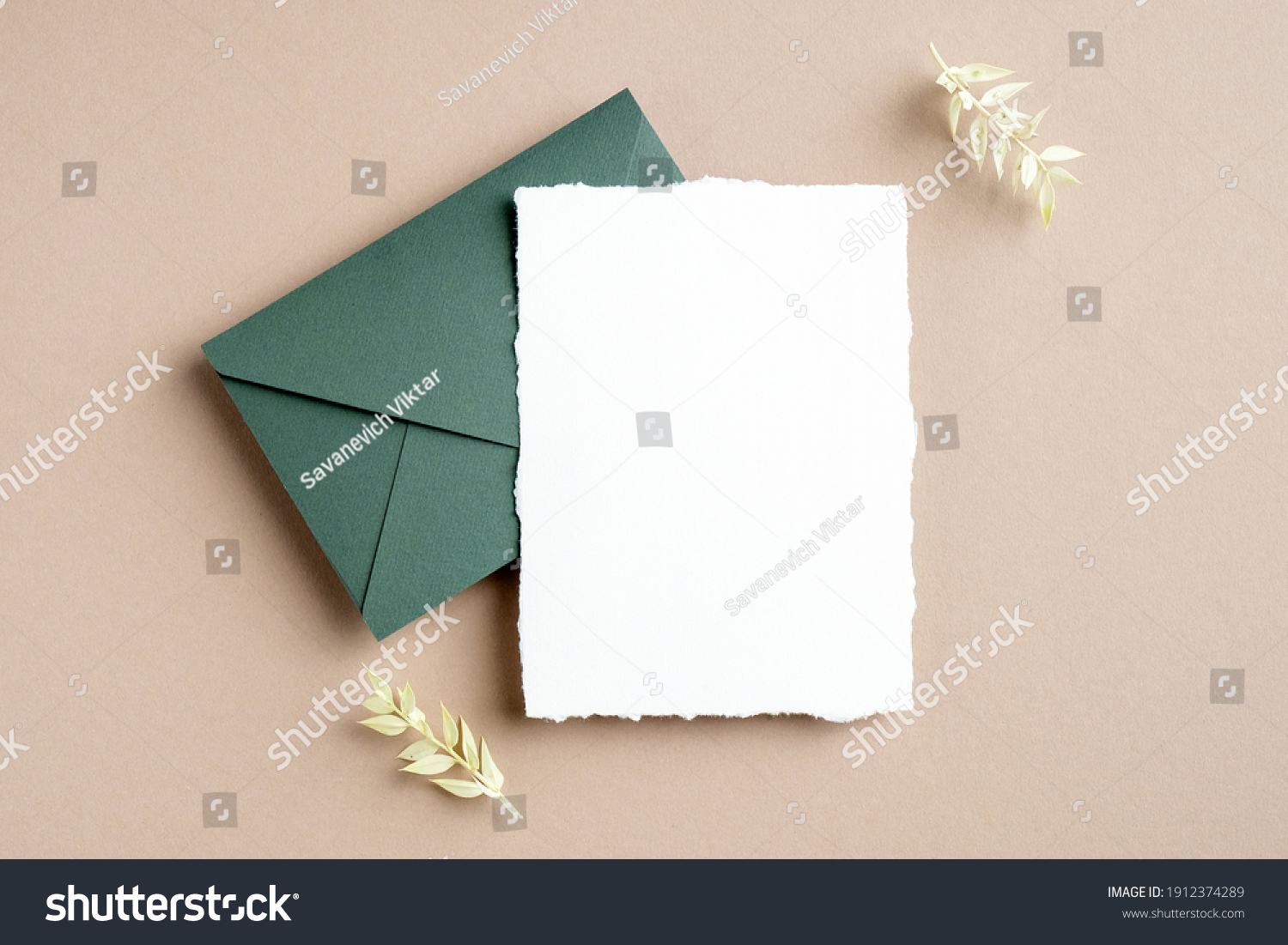 Rustic wedding invitation card mockup, green envelope and dried flowers on pastel beige background. Flat lay, top view, copy space. #1912374289