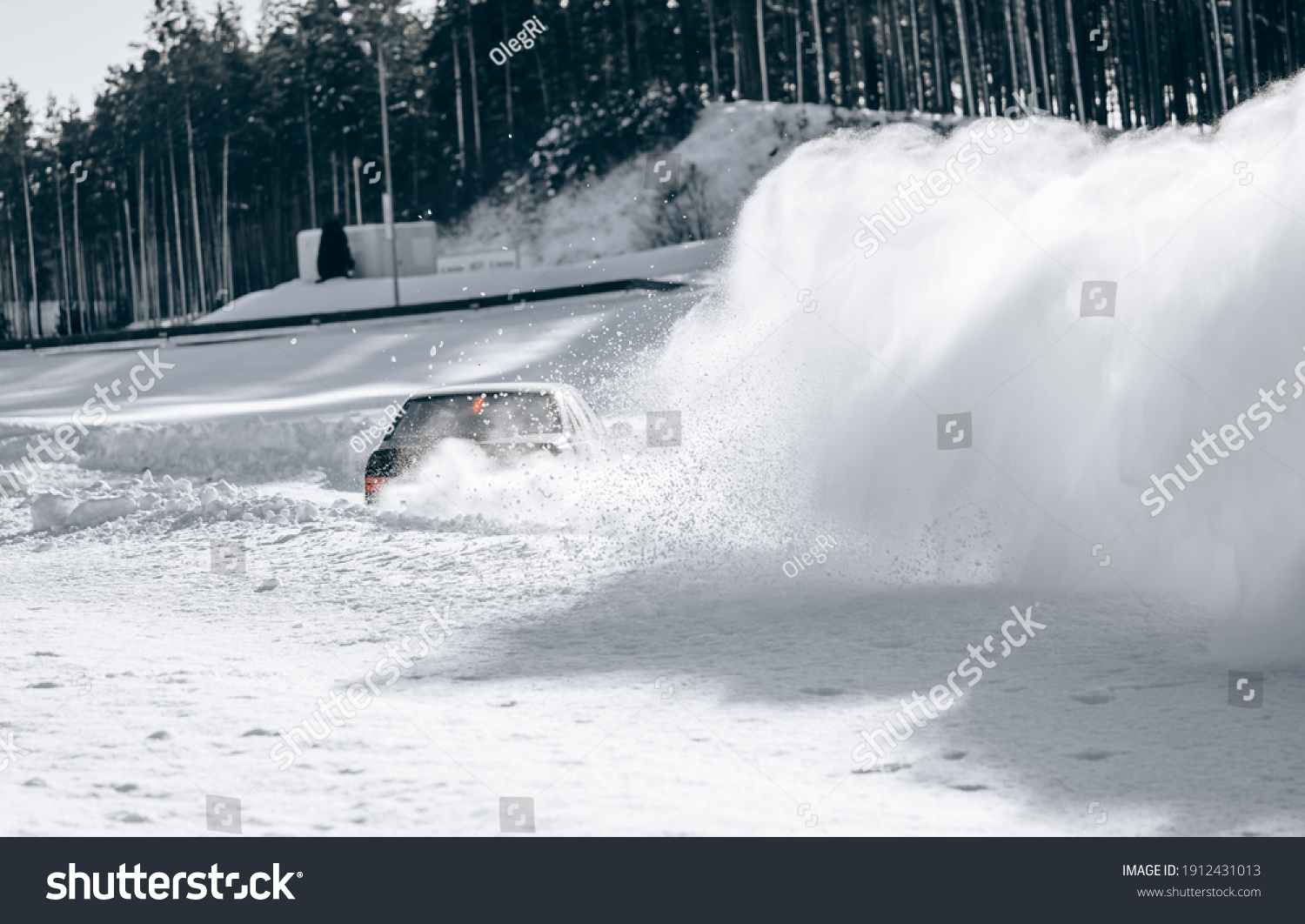 Sliding on an ice line. Snow drifting. snowy land road at winter #1912431013