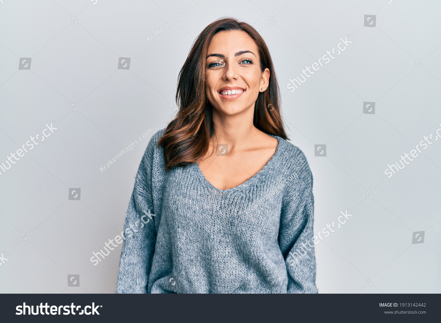 Young brunette woman wearing casual winter sweater with a happy and cool smile on face. lucky person.  #1913142442