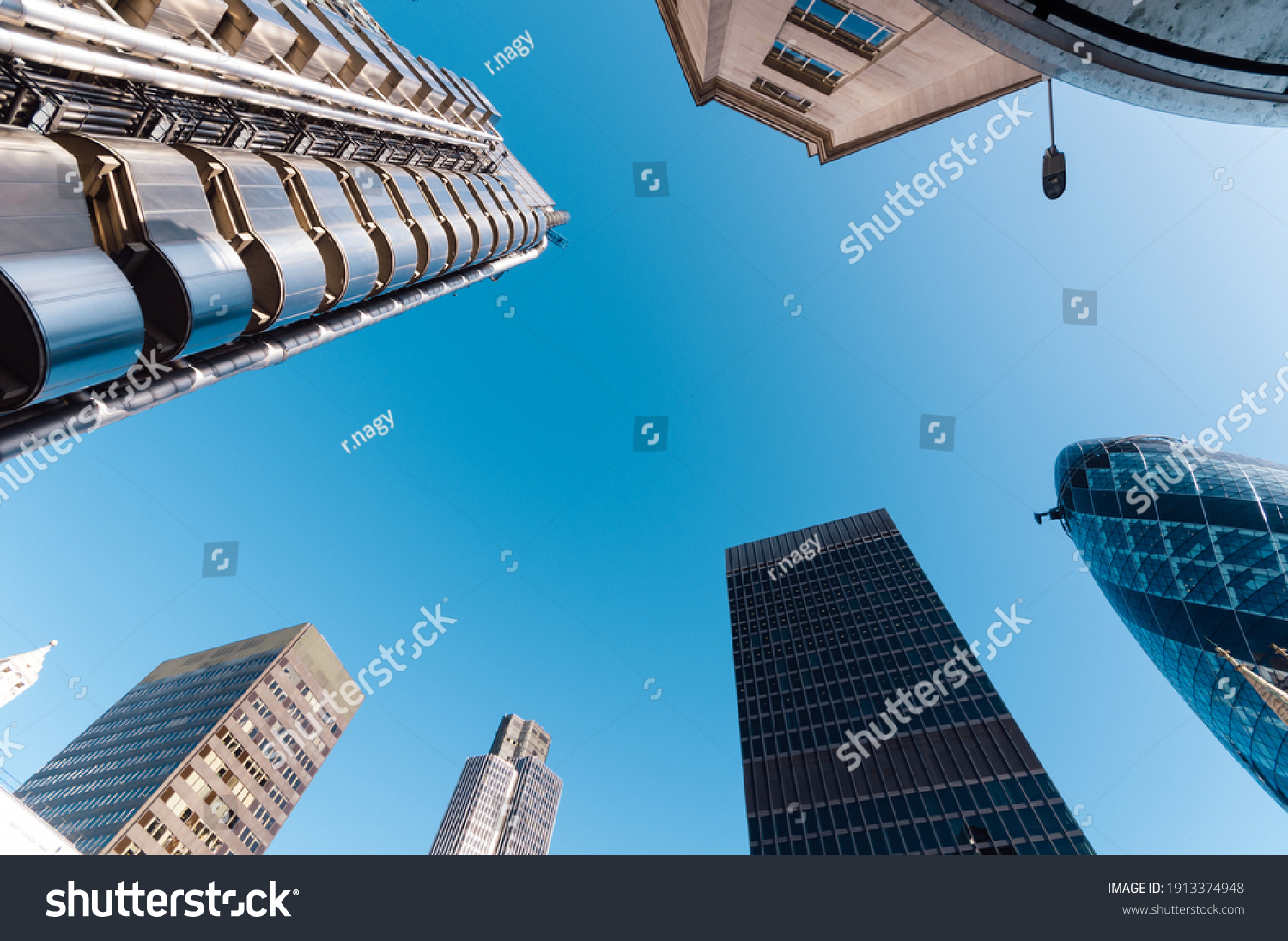 Looking directly up at the skyline of the financial district in the City of London #1913374948
