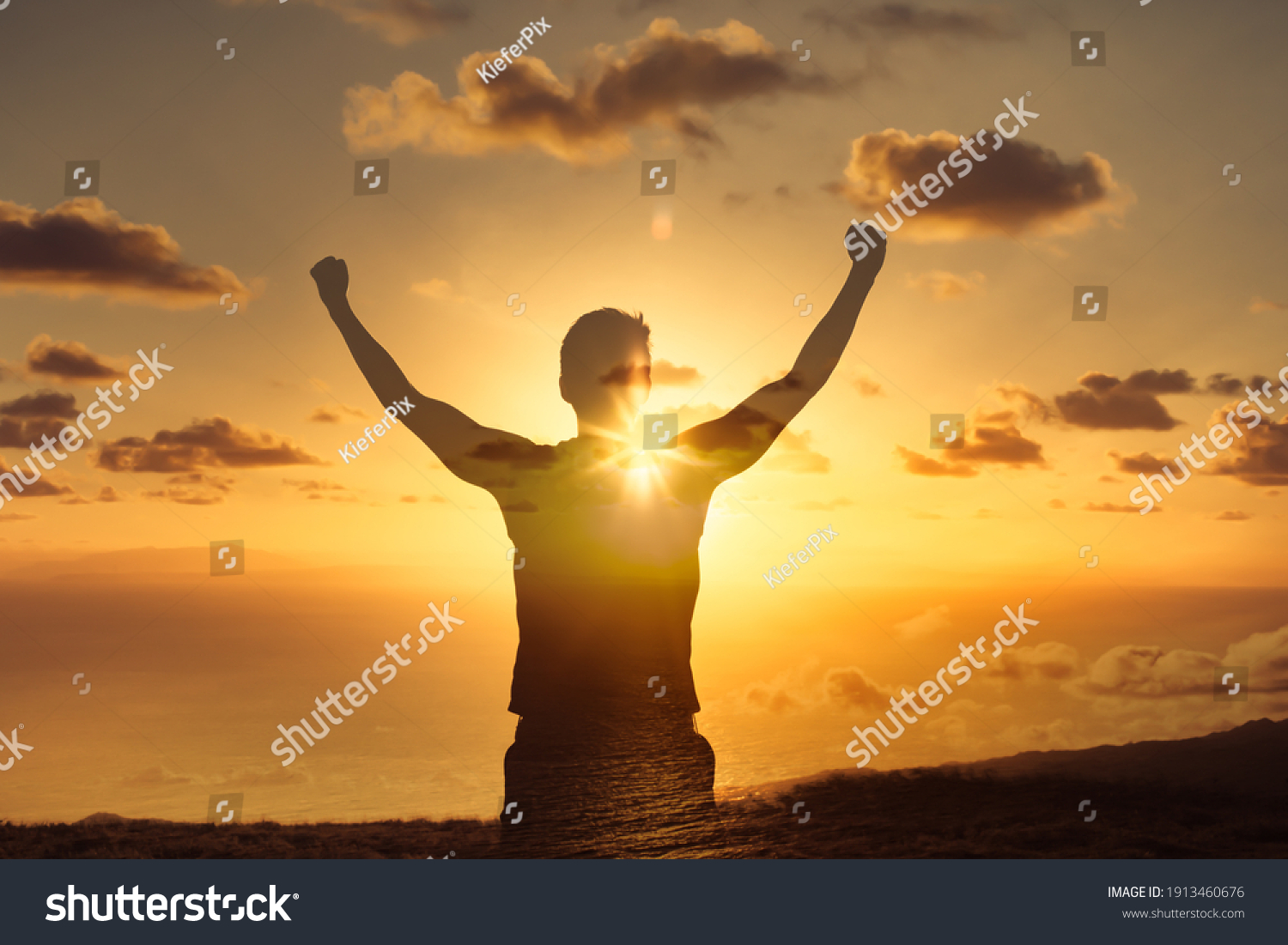 Strong powerful man flexing his arms up to the sky. Mental and physical strength concept. #1913460676